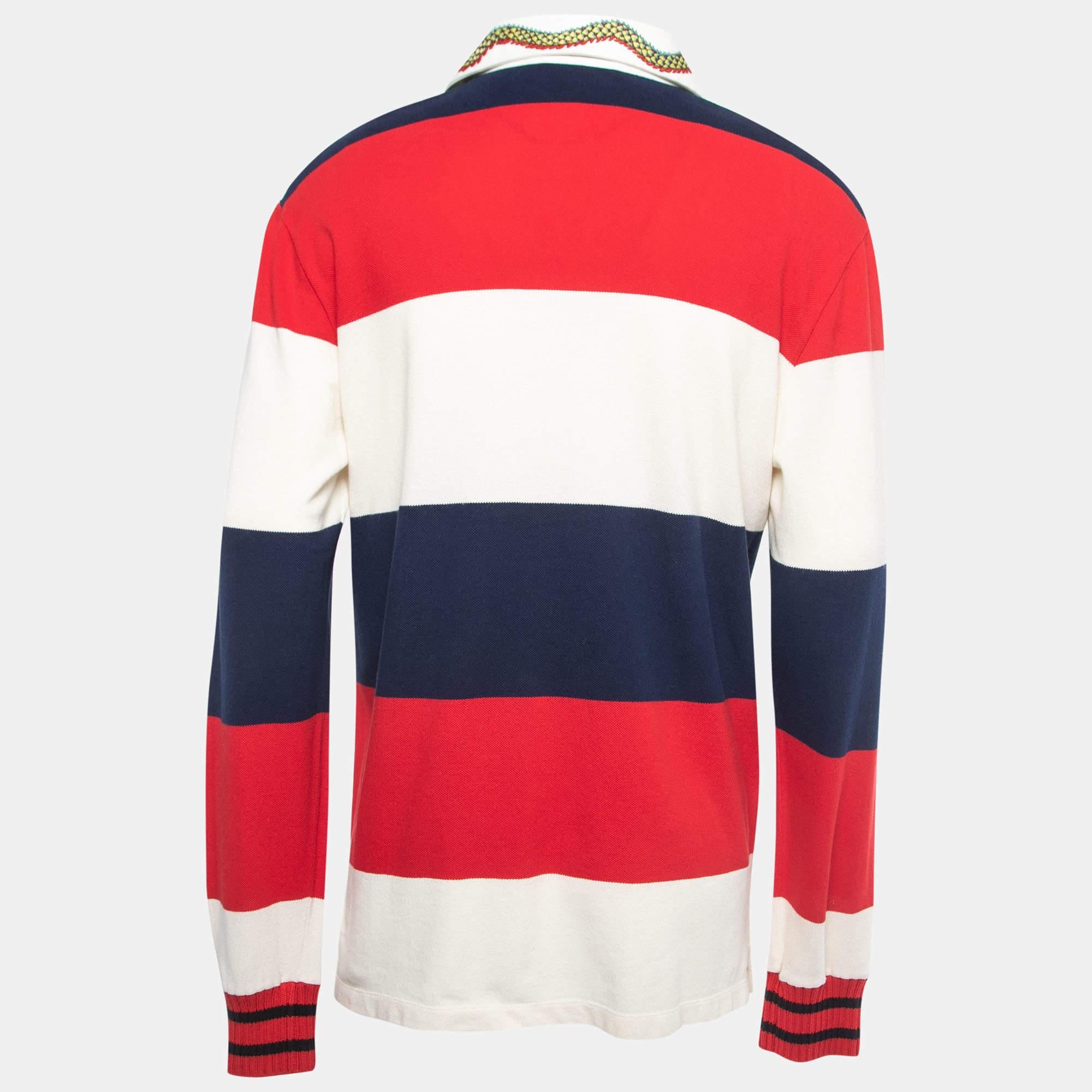 The Gucci t-Shirt combines vibrant stripes in various hues, crafted from comfortable cotton knit fabric. Its standout feature is the contrasting collar, adding a touch of sophistication. With long sleeves, it blends style and comfort in a