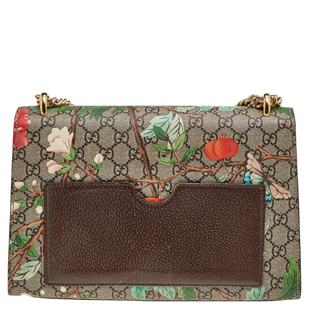 This chic and contemporary Gucci bag will help you outline a stylish look and outshine everyone else! Crafted from GG Supreme canvas with Tian prints, the rear side comes with a slip pocket for easy organization. The structured silhouette is secured