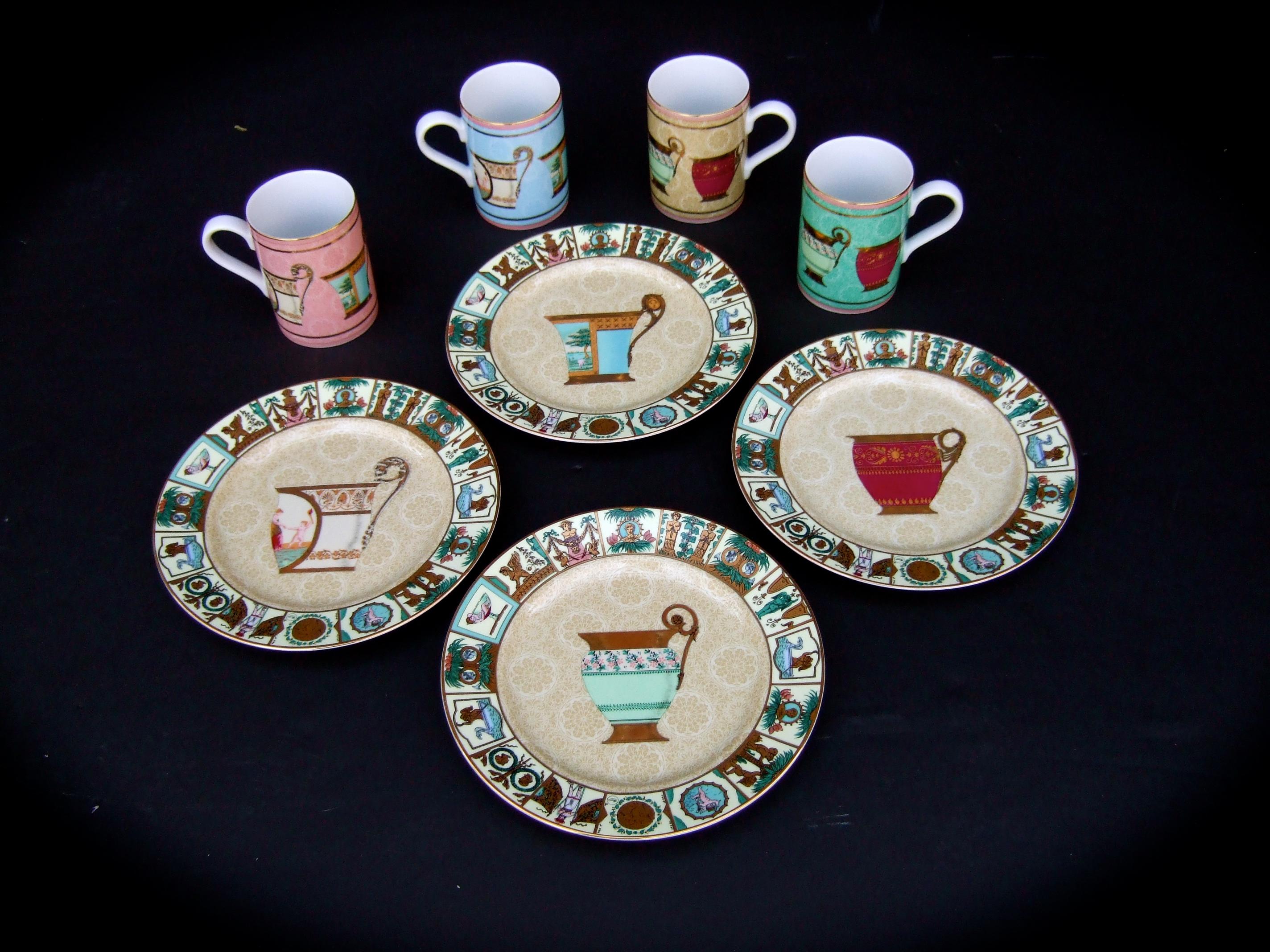 Gucci Mythological set of four desert plates & four porcelain ceramic mugs  21st c

The elegant porcelain ceramic mugs & desert plates are decorated with stenciled Roman figures & scenes that circle the border edge of the desert plates

The four