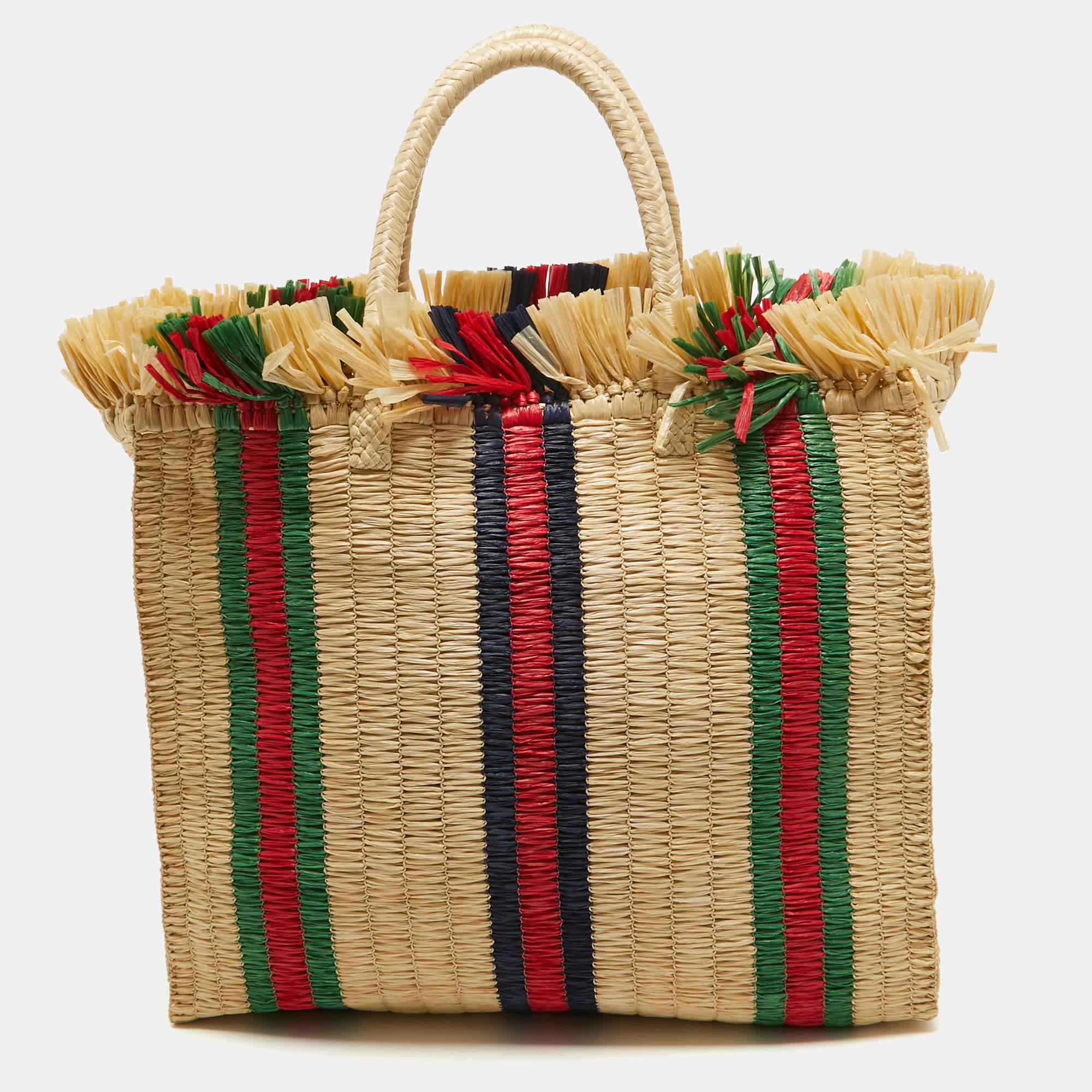 Created from high-quality materials, this Gucci straw tote is enriched with functional and classic elements. It can be carried around conveniently, and its interior is perfectly sized to keep your belongings with ease.

Includes: Fabric Pouch