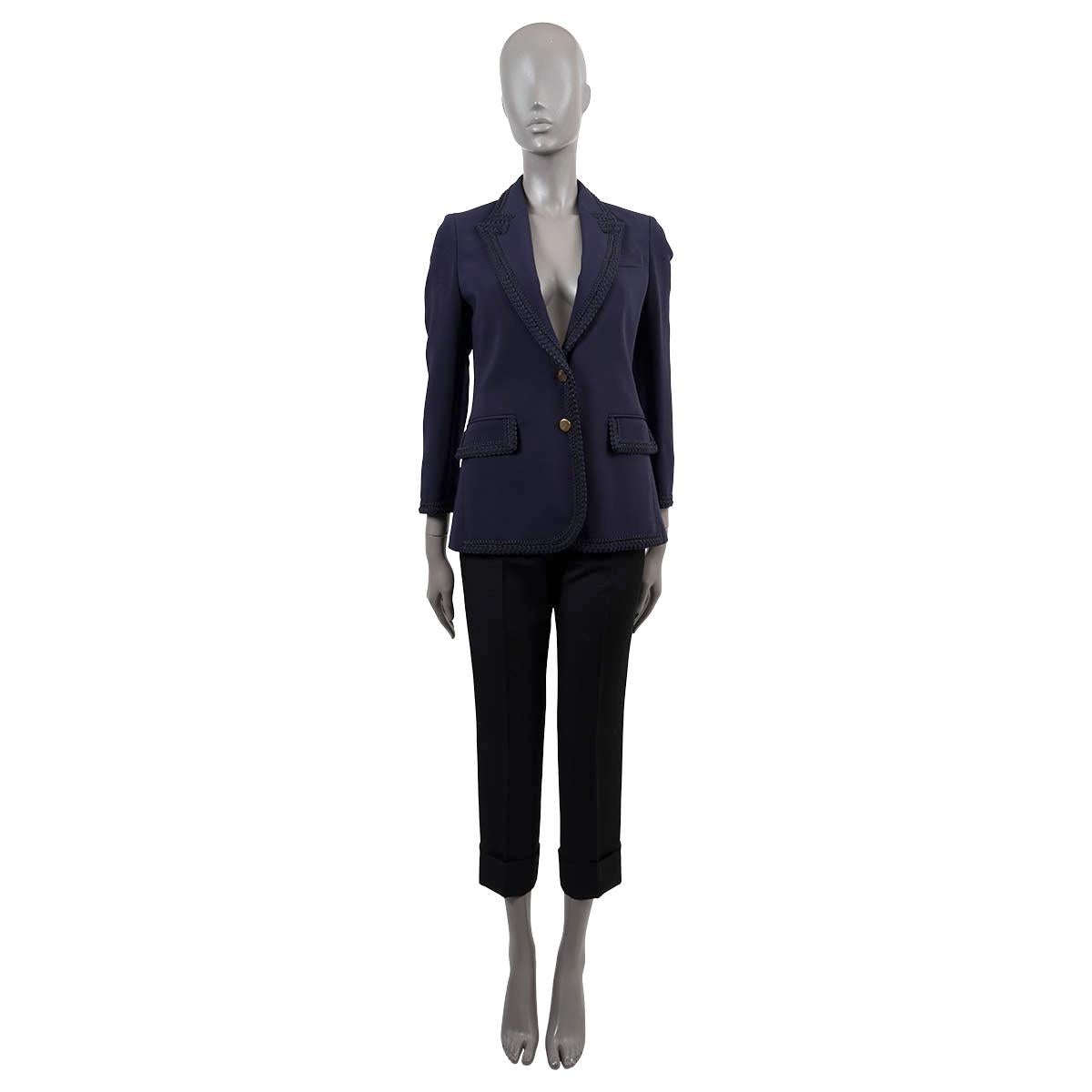 100% authentic Gucci passementrie trim stretch cady blazer navy blue viscose (97%) and elastane (3%). Features two patch pockets and one chest pocket. Opens with two golden buttons on the front. Lined in acetate (69%), cotton (19%) and polyester