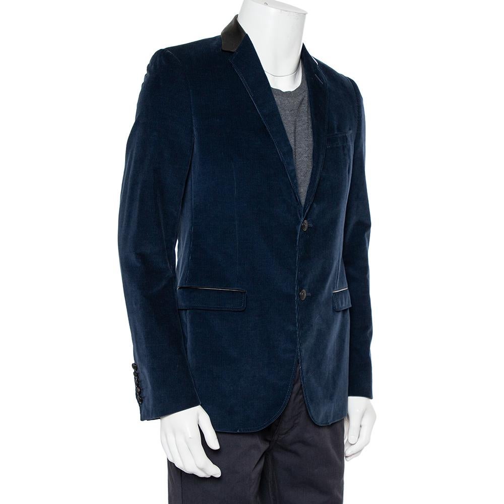 This men's blazer from Gucci is sure to make you look your best from every angle. The navy blue corduroy blazer features three pockets, leather trims and a button front closure.

