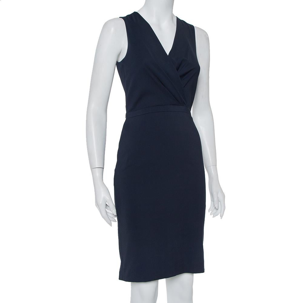 This elegant dress from the house of Gucci features a smart design making it a must-have piece in your closet. A feminine navy blue piece like this can be effortlessly styled with some statement pieces- say an embellished clutch. Crafted from cotton