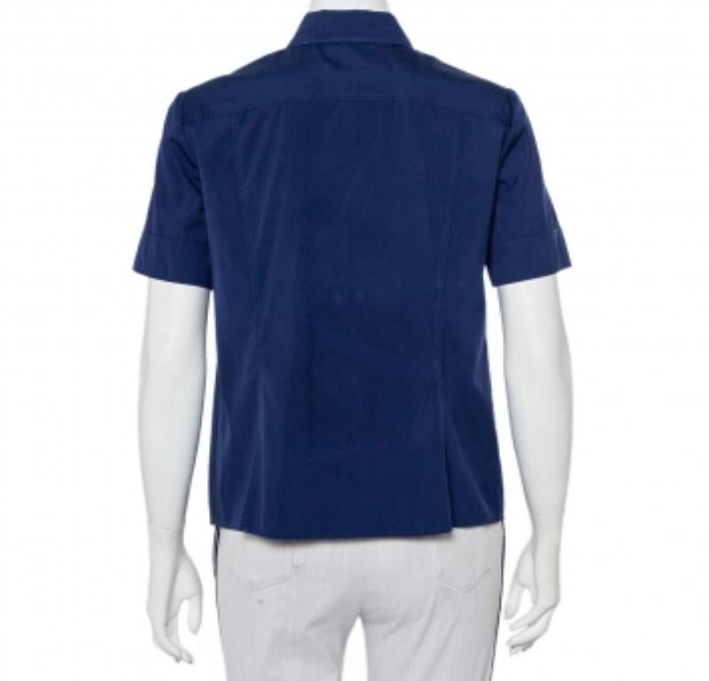 When it comes to unique designs, Gucci leads the choice. This shirt features a paneled look with a navy blue hue. It is designed with short sleeves and a simple collar. Cut from cotton, wear it with smart-fitting trousers for a smart look.
