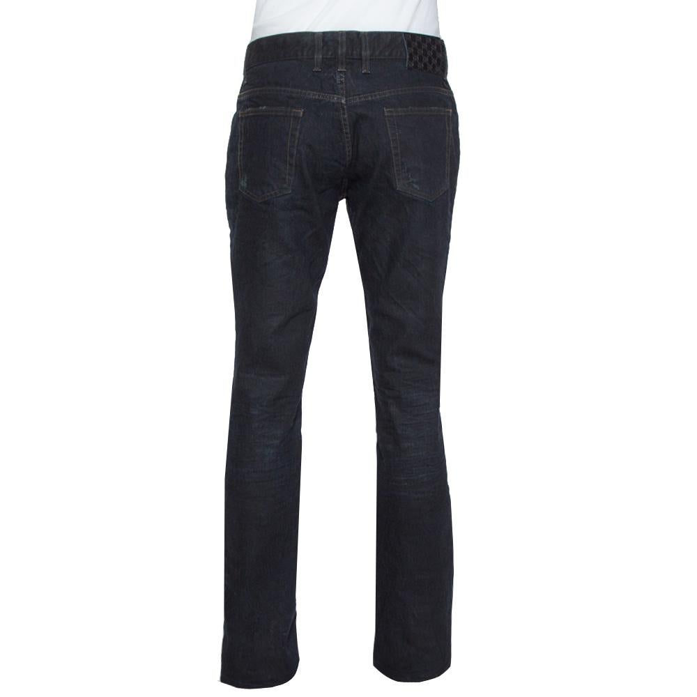 For days when you want to dress casually, this pair of Gucci jeans will be just right. Made from cotton, the dark wash jeans feature belt loops, pockets, front closure and signature details of the brand. The pair will offer you a nice straight fit.

