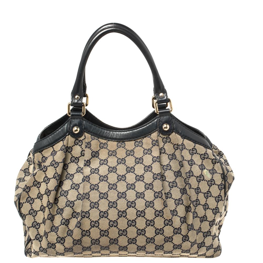 The Sukey is one of the best-selling designs from Gucci, and we believe you deserve to have one too. Crafted from GG canvas and leather in beige and navy blue hues and equipped with a spacious interior, this tote is ideal for you and will work