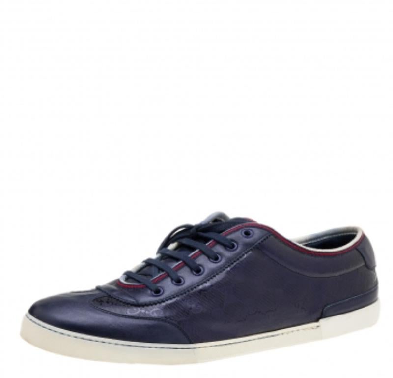 How cool are these navy blue sneakers from Gucci! They've been made from coated canvas and leather and flaunt matching blue-tone hardware. They have neatly-placed shoelaces and sturdy rubber soles for a comfortable walk.