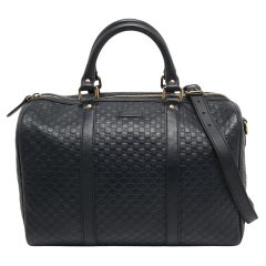 Sac Boston Joy de Gucci en cuir Guccissima bleu marine de taille moyenne