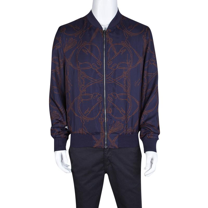 Layering up doesn't have to be just about convenience and comfort anymore. The Gucci Navy Blue Horse Printed Silk Zip Front Bomber Jacket is here to express your style even when you need to cover up. The silk is comfortable to carry through the day