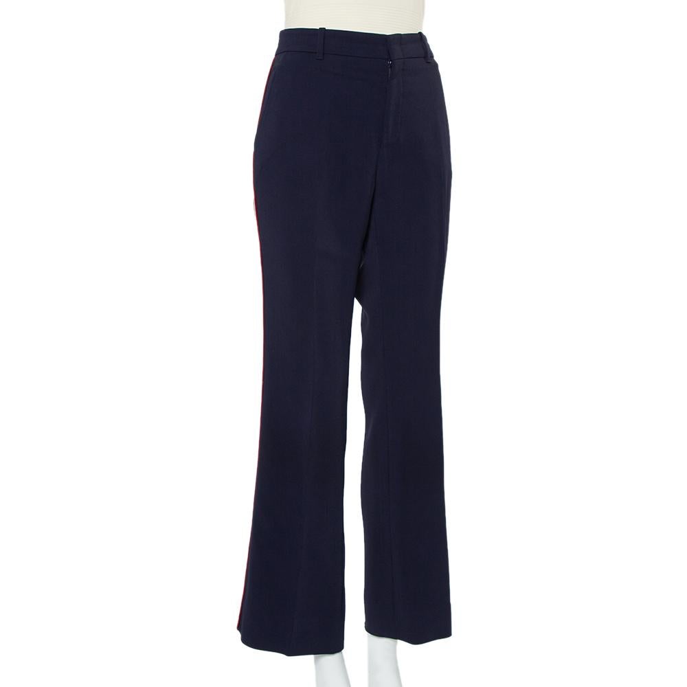 Tailored using knit fabric, this pair of Gucci Bootcut pants features a slightly flared hem and contrasting trim on the sides. The pair is equipped with four pockets and front zip & hook closure.

