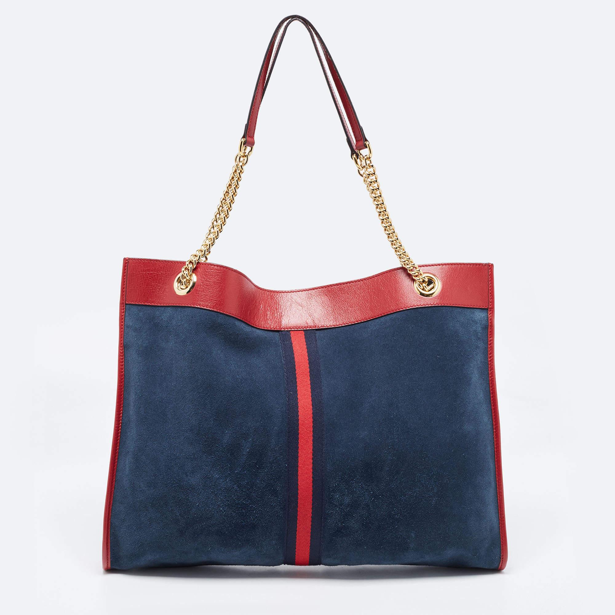This beautifully stitched signature canvas and leather tote is by Gucci. With a capacious leather-lined interior, it promises to house more than your essentials. Boasting two handles and a fine finish, this tote offers style and practical ease.

