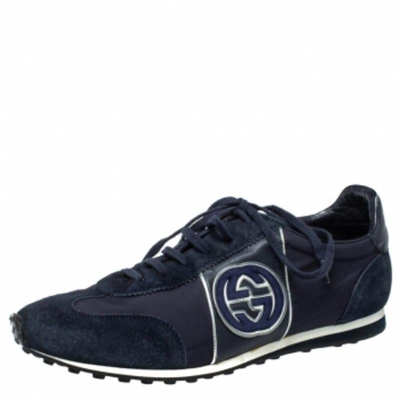 Enjoy footwear ease with this pair of sneakers by Gucci. They've been crafted from suede and fabric and designed with round toes, lace-ups on the vamps, and the interlocking G logo on the sides. The leather insoles and rubber outsoles add to the