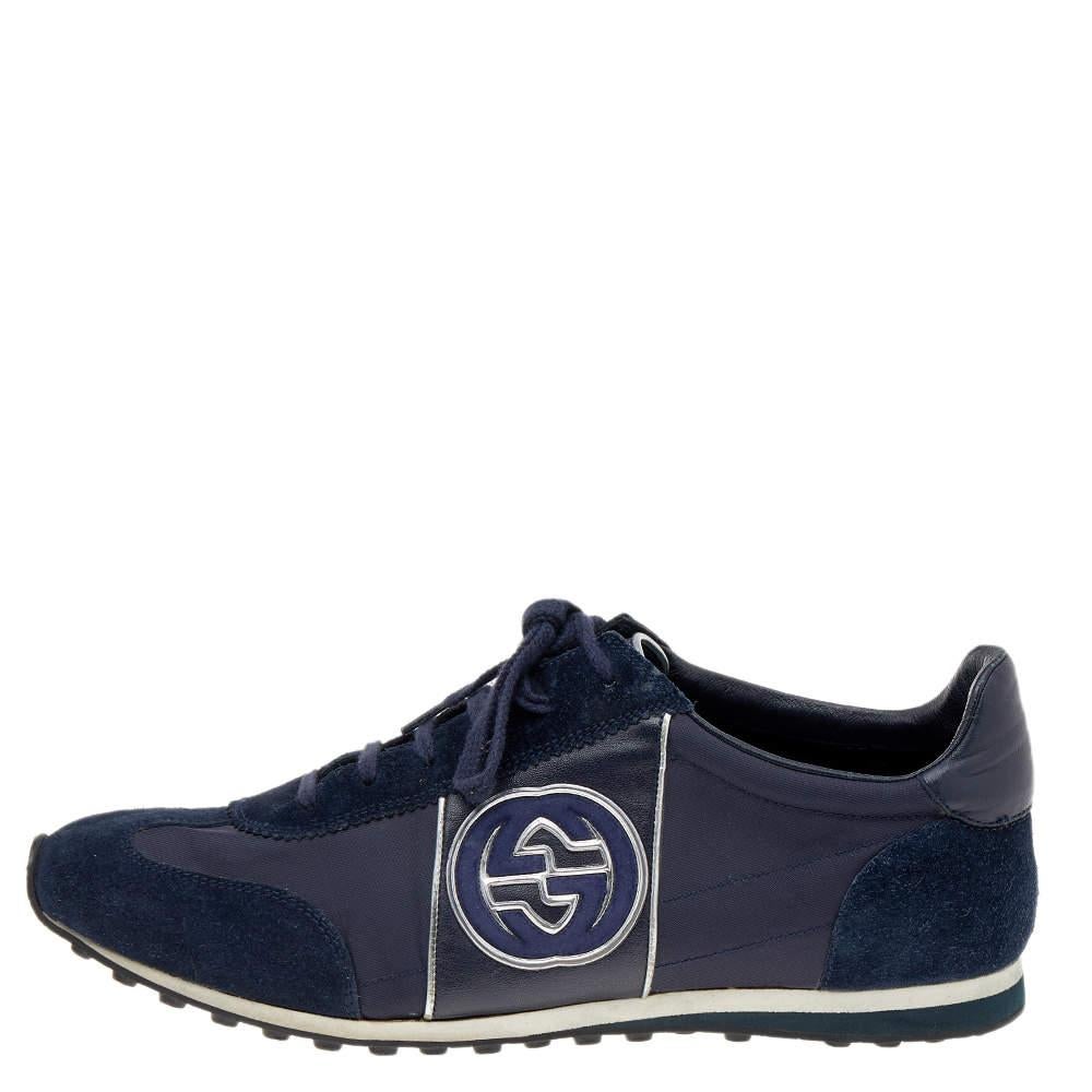 Designed by the House of Gucci, these sneakers are made to offer nothing but unparallel comfort and style. They are crafted using navy-blue suede and nylon on the exterior and flaunt lace-ups on the vamps, a GG logo print on the side, and a low-top