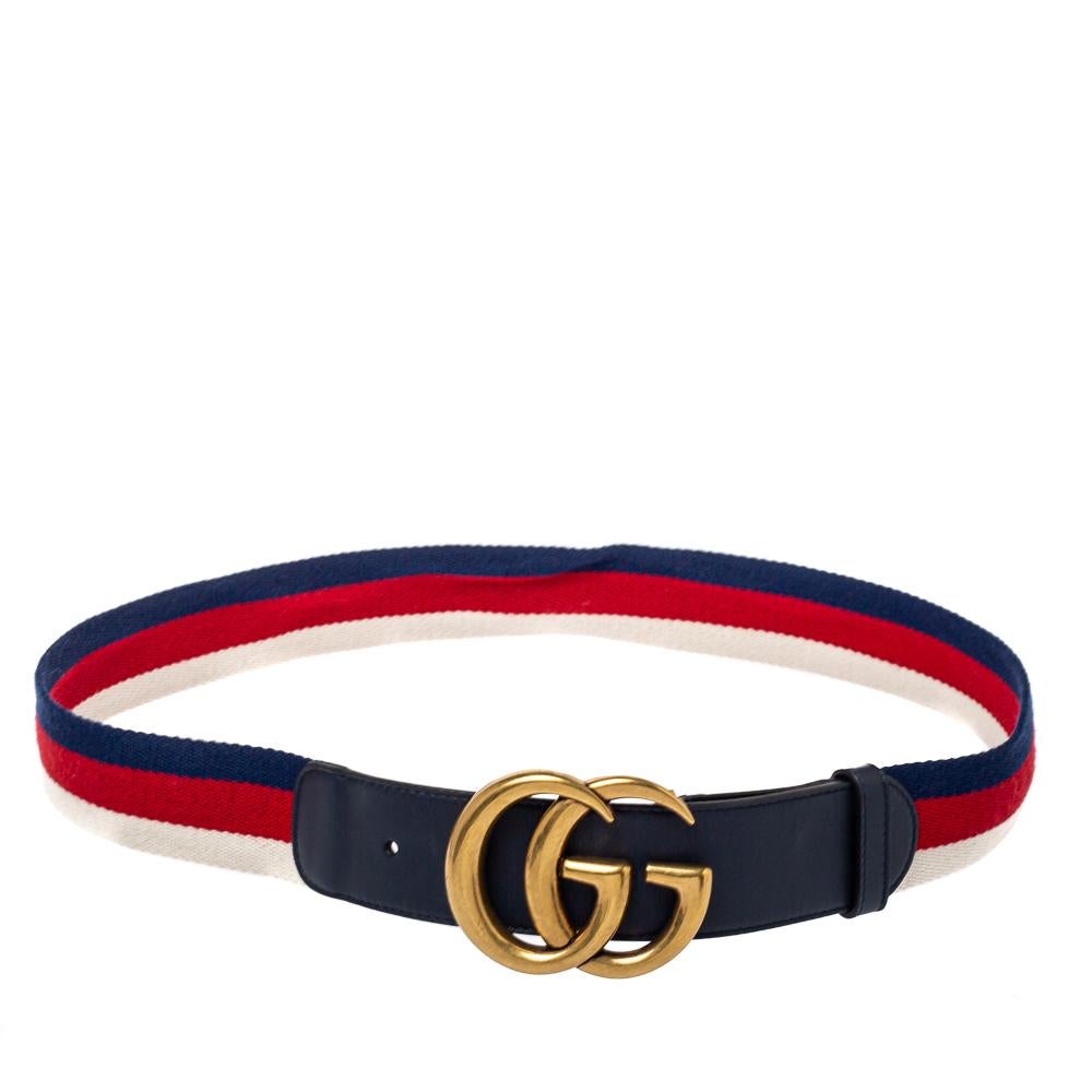 Enhance your belt collection by adding this buckle belt from Gucci. Crafted from leather and canvas, the navy blue piece is complete with the iconic interlocking GG buckle, web detailing, gold-tone hardware, and a single loop. The sophisticated belt