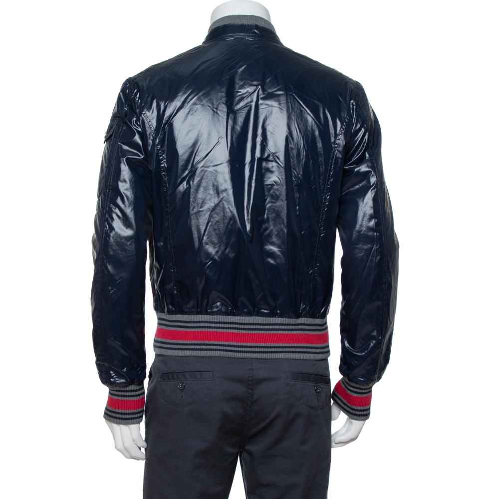 Get that simple yet in-style look with this Gucci bomber jacket. Crafted from quality fabric, it comes in a lovely shade of navy blue. It has a zip front, Web trims along the sleeves and hemline, and a good fit. It is great for impromptu outings and