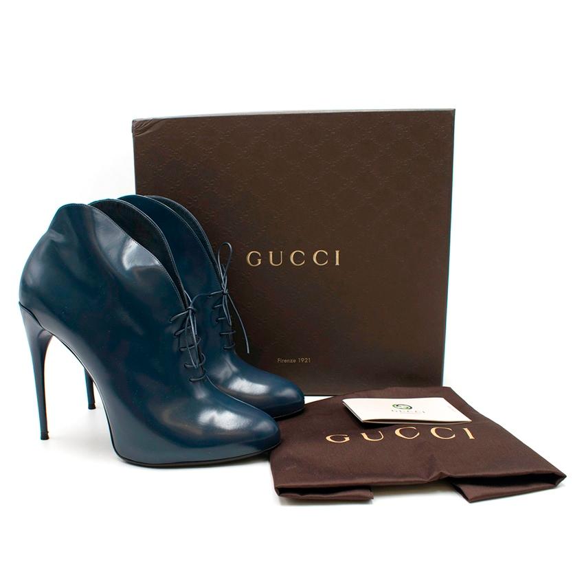 Gucci Navy Caspian Stiletto Booties

- Caspian style booties
- Shiny navy leather
- Lace-up with skinny leather laces
- Almond toe
- High stiletto heel
- Concealed platform
- Low cut front and back
- Curved shape on each side at the leg opening
-