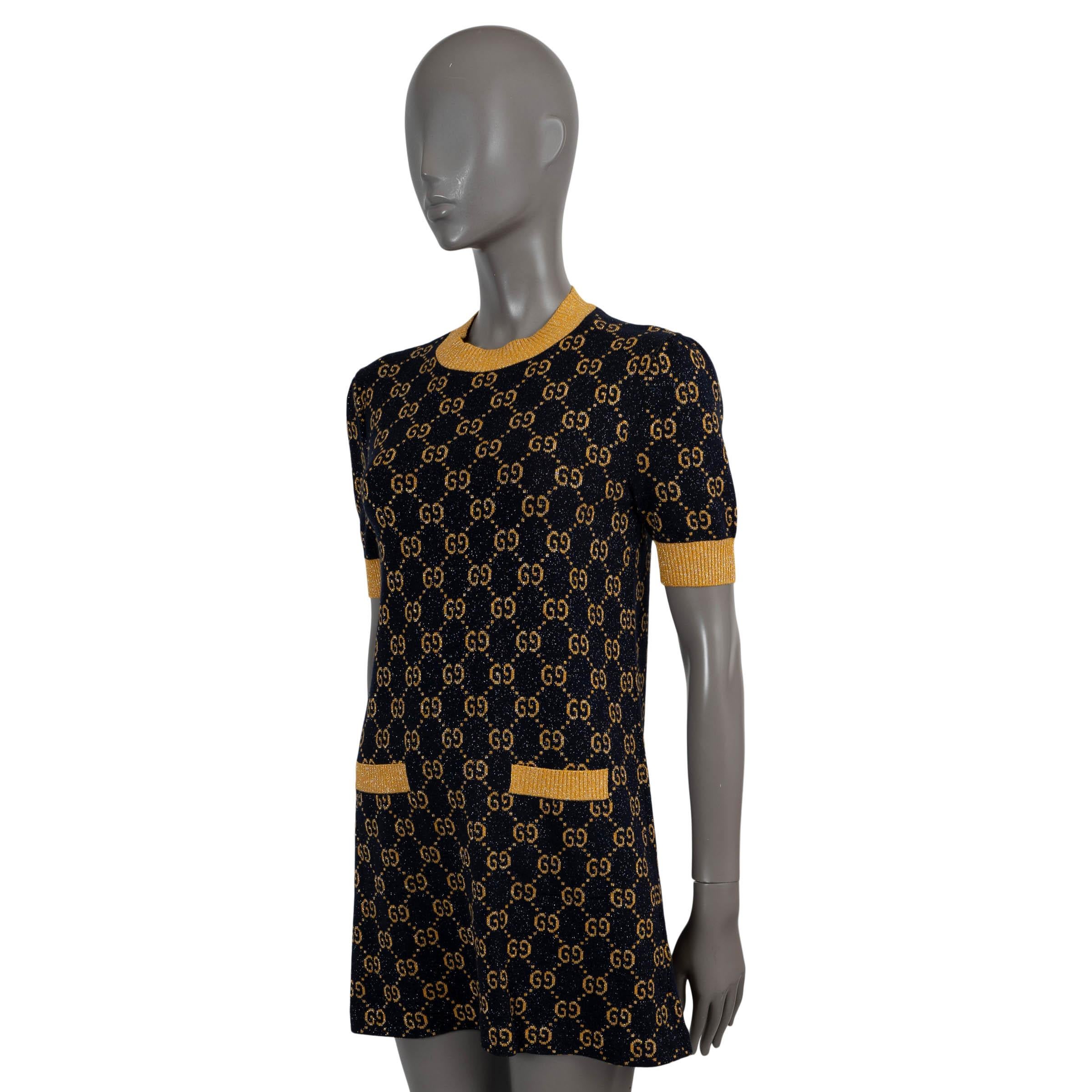 100% authentic Gucci GG lurex jacquard knit dress in navy blue and gold cotton (86%), metallized fiber (9%) and polyamide (5%).  Features a crewneck, two open pockets at the waist and short sleeves with rib-knit cuffs. Unlined. Has been worn and is