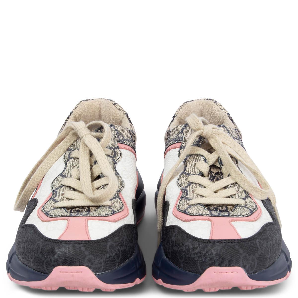 100% authentic Gucci 2022 Rhyton sneakers in beige, rose pink, white and navy blue GG Supreme canvas with navy blue and rose pink rubber sole. Have been worn twice and are in excellent condition. 

Measurements
Imprinted Size	36.5
Shoe