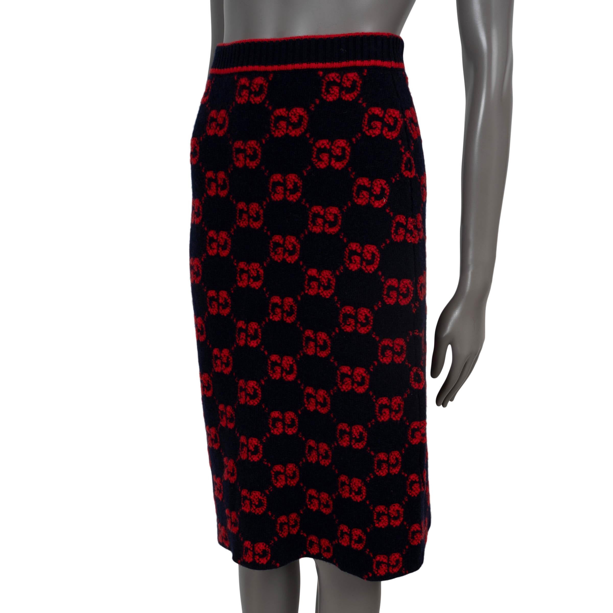 100% authentic Gucci GG bouclé jacquard midi skirt in navy blue and red wool (100% - please note the content tag is missing). Features a rib-knit waist band and is unlined. Has been worn and is in excellent condition. 

Complete the looking with