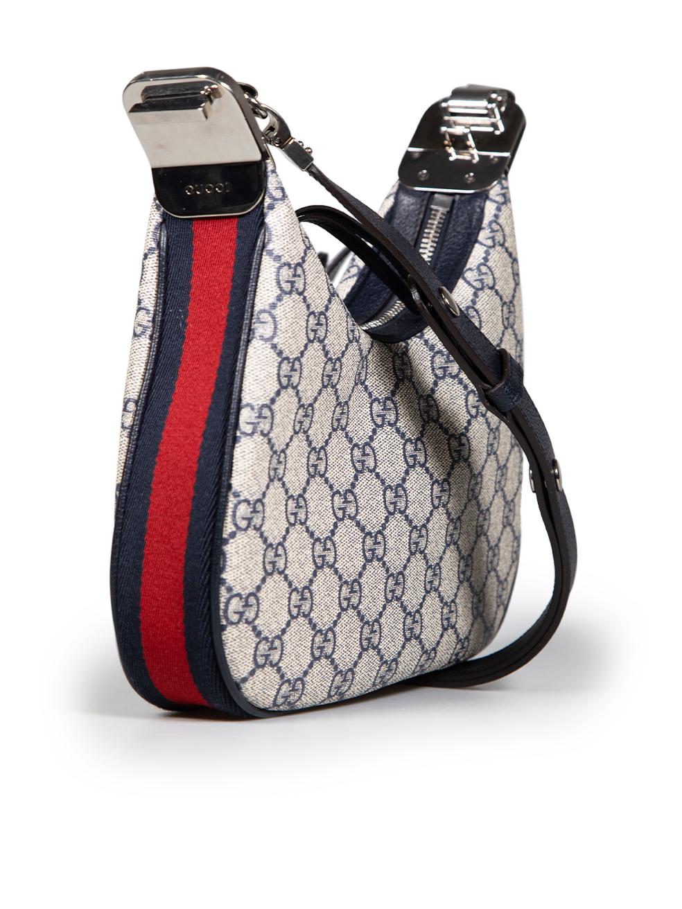 CONDITION is Very good. Minimal wear to bag is evident. Minor scratches on the hardware due to poor storage on this used Gucci designer resale item. This item comes with a dust bag and box.
 
 Details
 Model: Attache
 Navy
 Coated canvas
 Medium