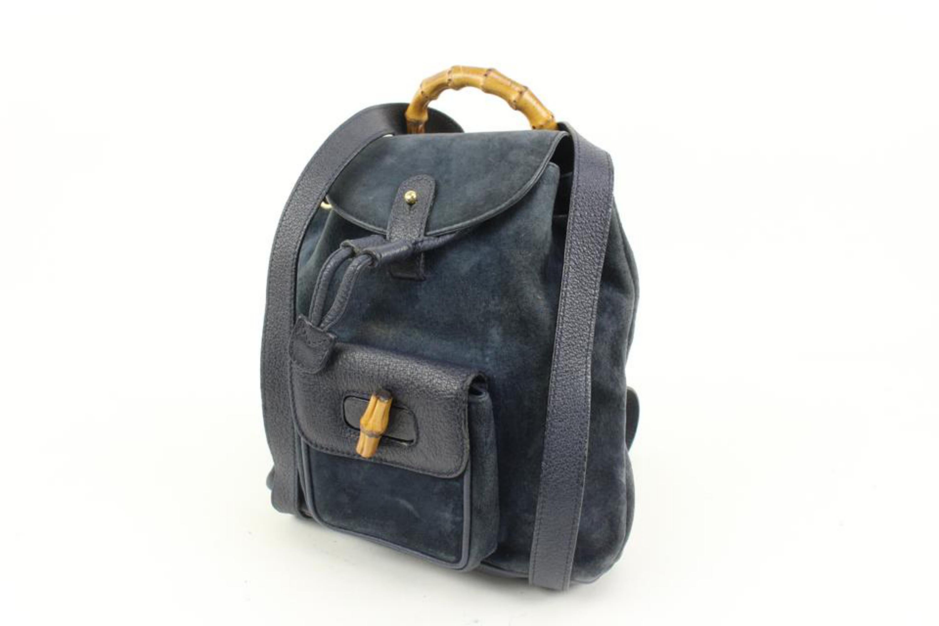 Gucci Navy Suede Bamboo Mini Backpack 56gz421s
Date Code/Serial Number: 003-8030 1705
Made In: Italy
Measurements: Length:  10.5