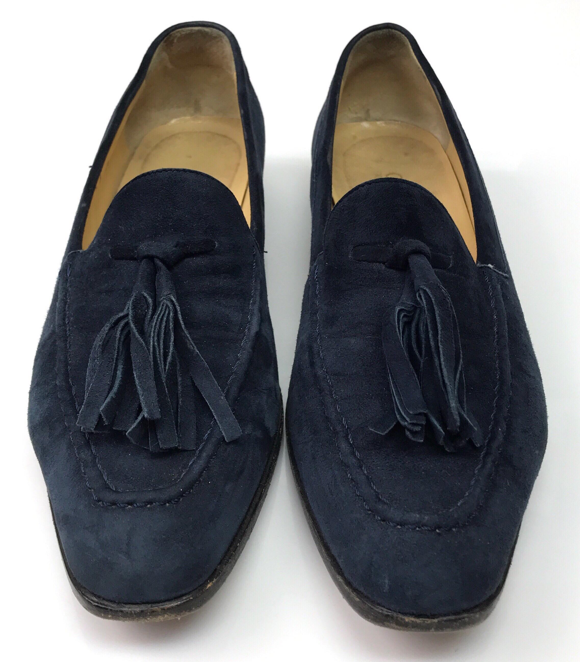Gucci Navy Suede Tassel Loafer - 6. These amazing Gucci loafers are in good condition. They are have some signs of use, including small stains on the inside and outside, and the bottoms being rubbed off. They are made of navy suede and have tassels