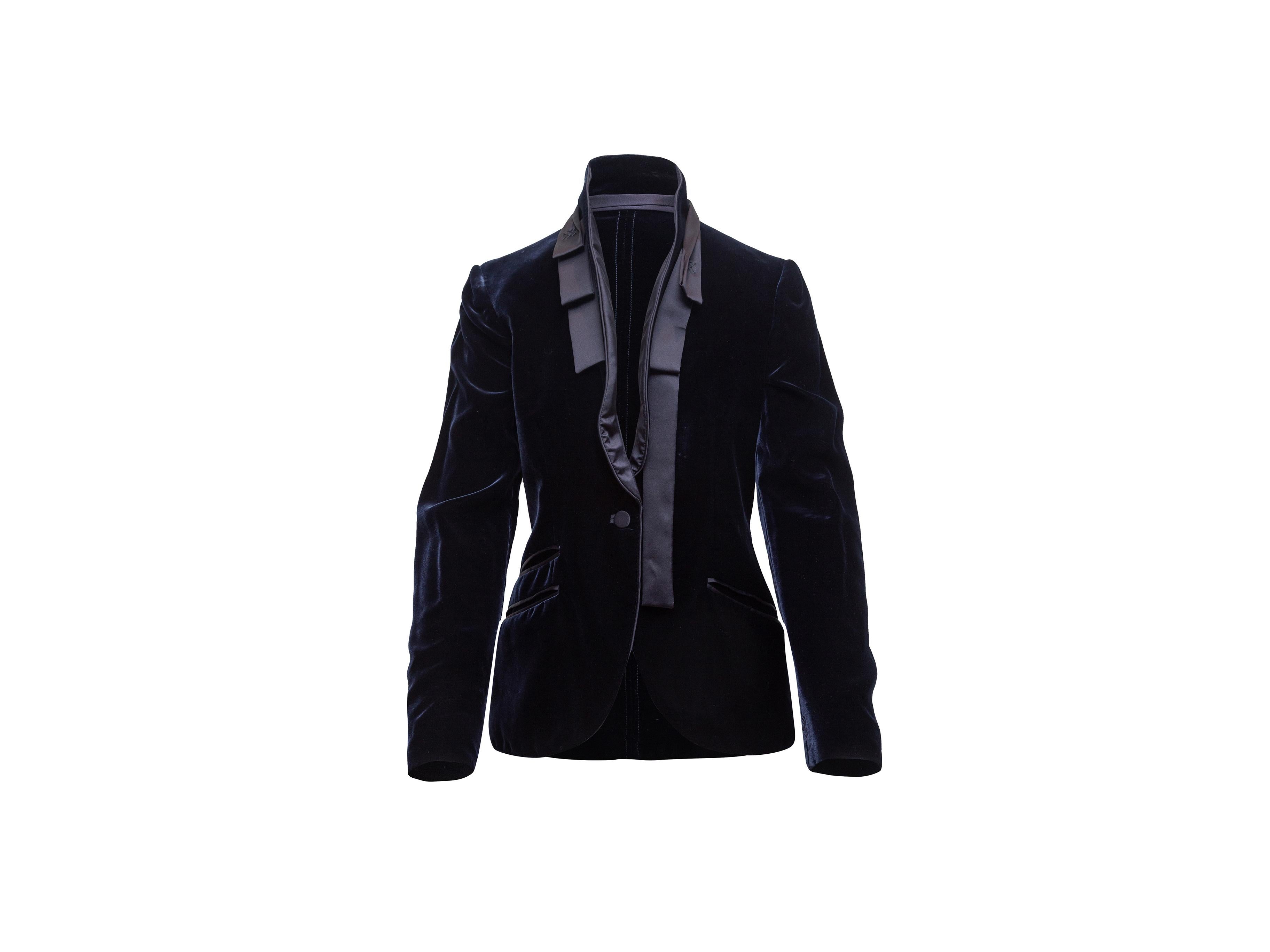 Product details: Navy velvet blazer by Gucci. Pleated silk collar. Three welt pockets at hips. Single button closure. Designer size 44. 34