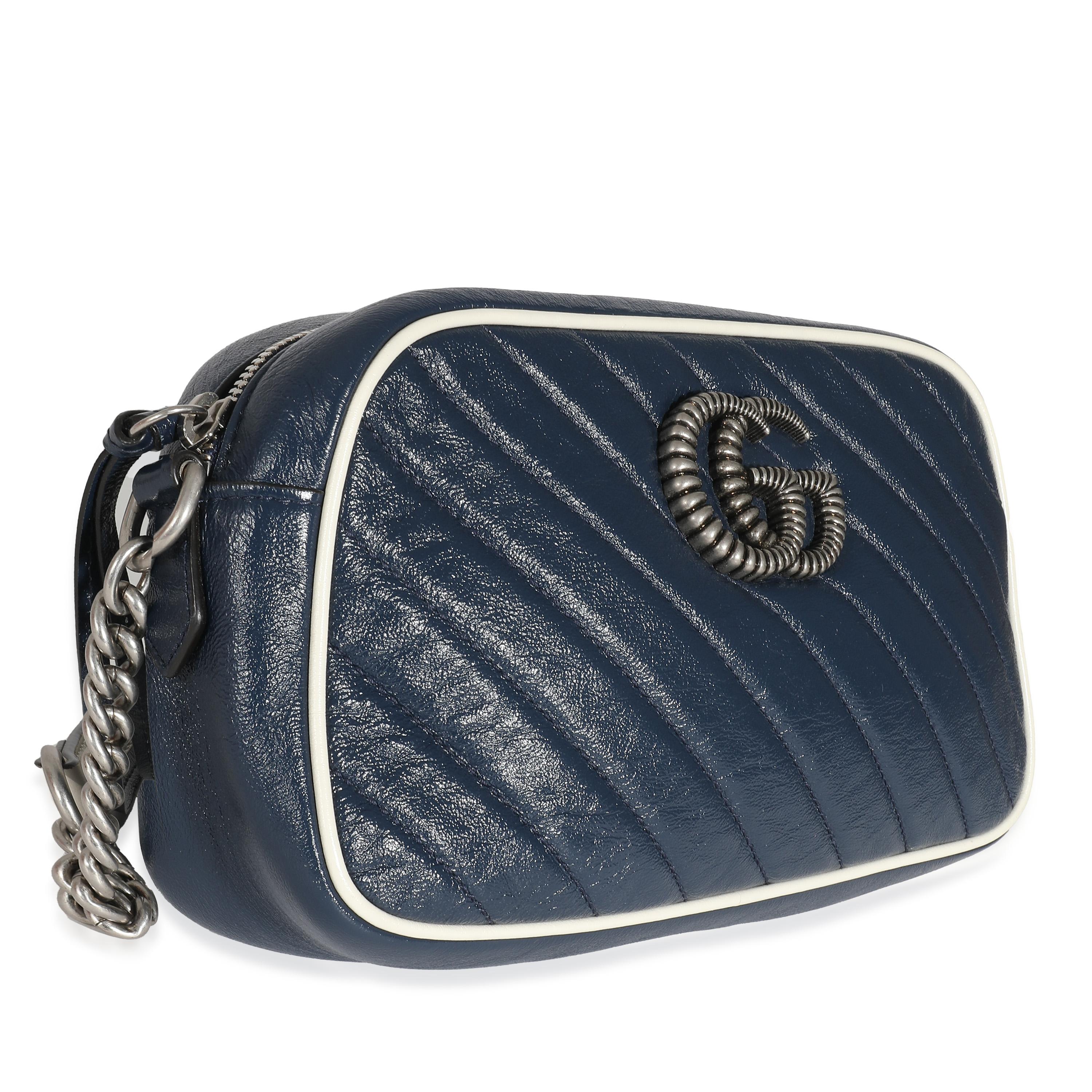 Listing Title: Gucci Navy White Matelasse Leather Small Torchon GG Marmont Shoulder Bag
SKU: 137239
Condition: Pre-owned 
Condition Description: The Marmont edit from Gucci is an extension of the House's signature GG belt from the '70s. With a