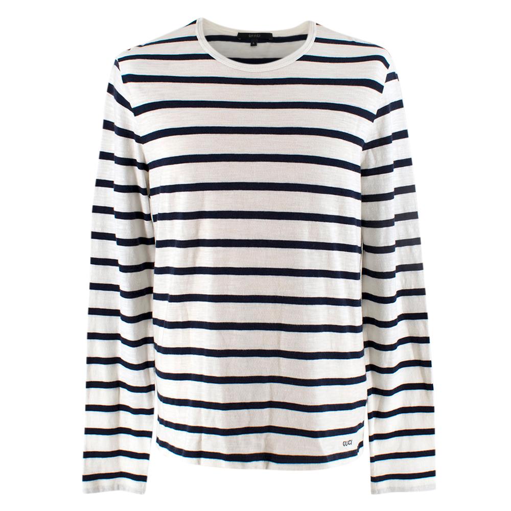 Gucci long sleeves top

navy blue stripes;
Gucci logo on bottom right;
round neck top;
made in Italy

Please note, these items are pre-owned and may show signs of
being stored even when unworn and unused. This is reflected within the
significantly