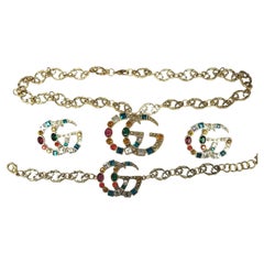 Ensemble collier, bracelet et boucles d'oreilles Gucci Marmont GG cristal et plaqué or