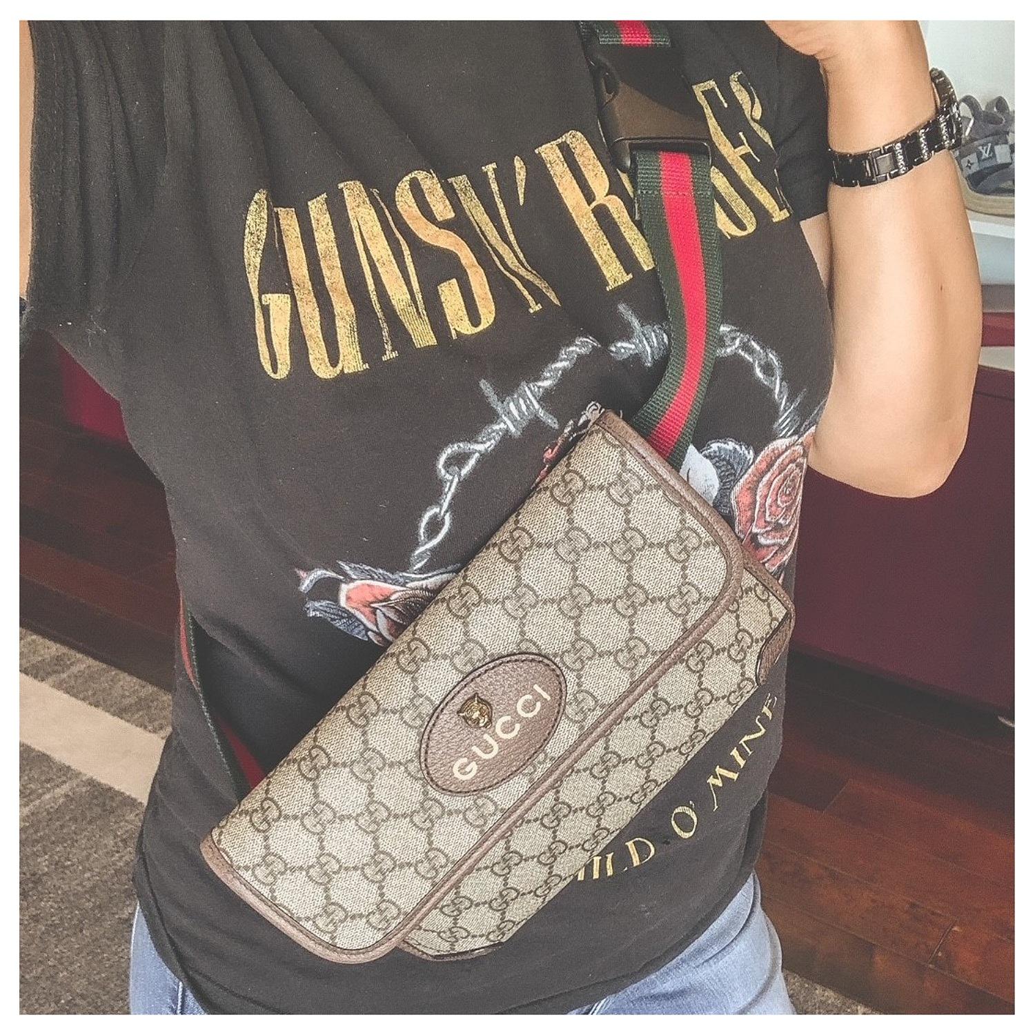 The belt bag in GG Supreme has a retro influenced design. Trimmed with leather, the style is meant to be worn along the waist, secured with a Web strap and buckle closure. Features an oval Gucci leather tag with feline head. Can be worn as a belt