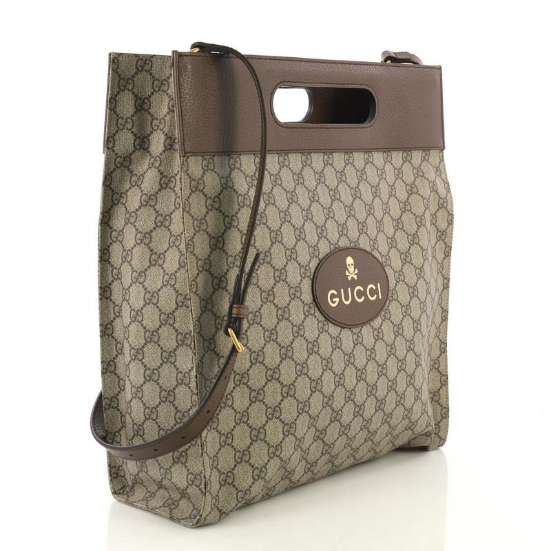 This Gucci Neo Vintage Soft Tote GG Coated Canvas Medium, crafted from light brown GG coated canvas, features cut out top handles and gold-tone hardware. It opens to a beige canvas interior with side zip pocket.

Estimated Retail Price: