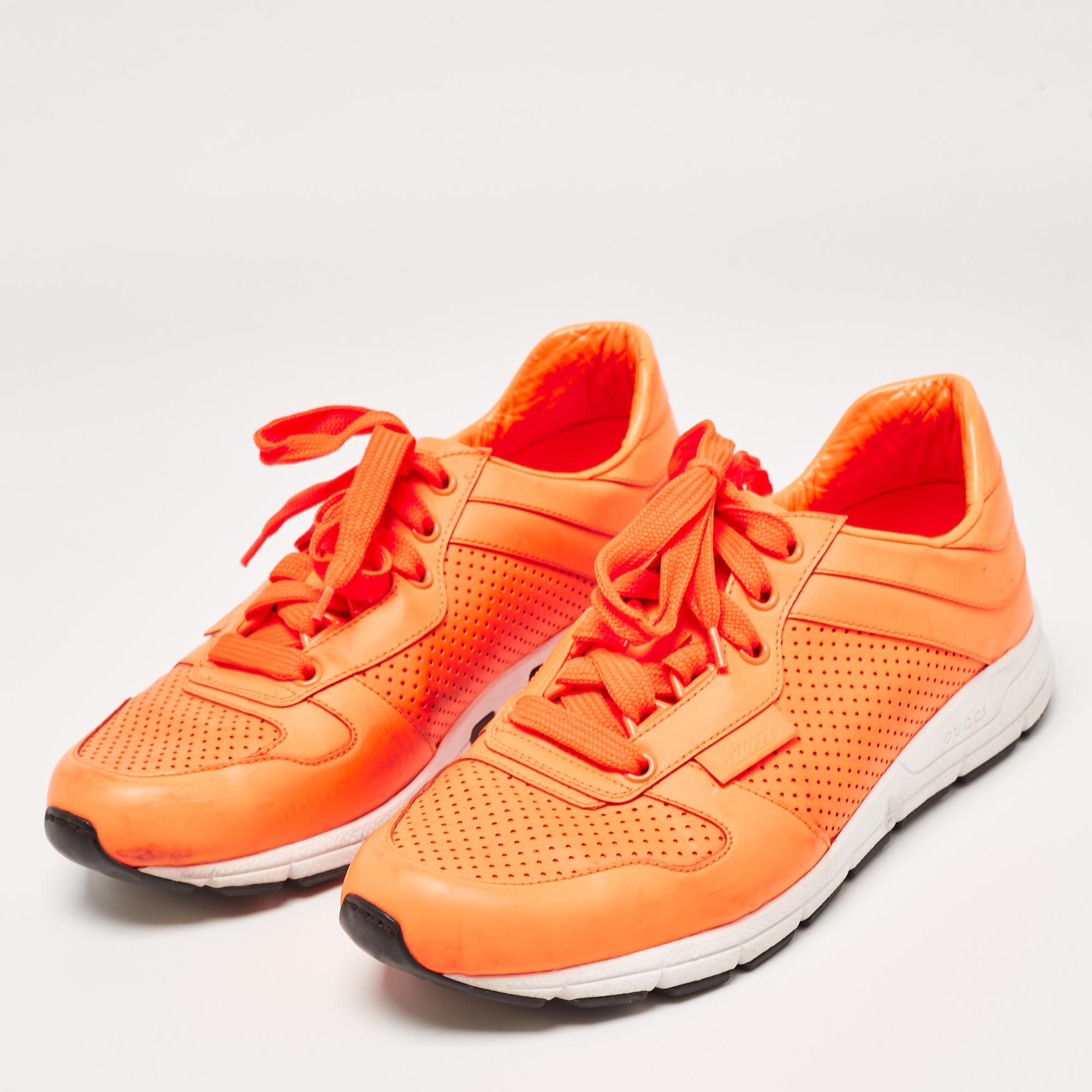 We love how a good pair of sneakers can elevate even a simple look. Made in Italy from leather, this striking pair by Gucci is presented in neon orange and amplified with clean details, matching laces and durable white midsoles.