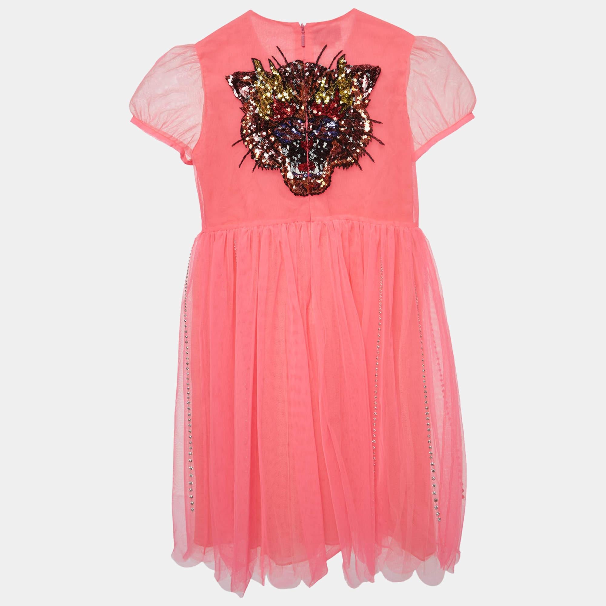 A dazzling fusion of vibrant neon pink crystal embellishments and a sequin detailed tiger motif this Gucci dress for 10 year olds captures the essence of playful sophistication for the young fashionista.