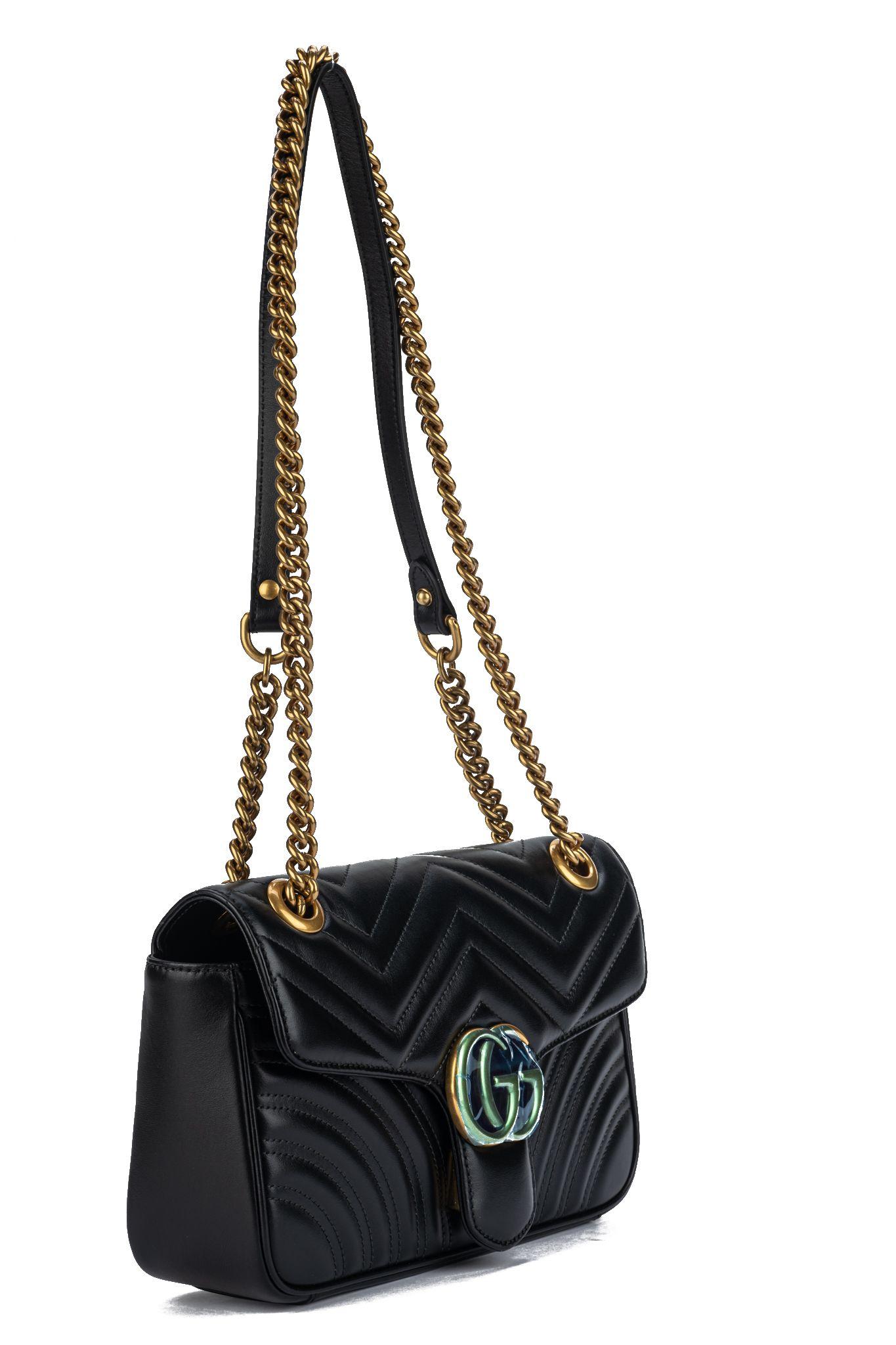 Gucci brand new marmont small handbag in black leather and bronze hardware. Shoulder drop 12”/22”. Comes with booklet, original dust cover and plastic on hardware.

