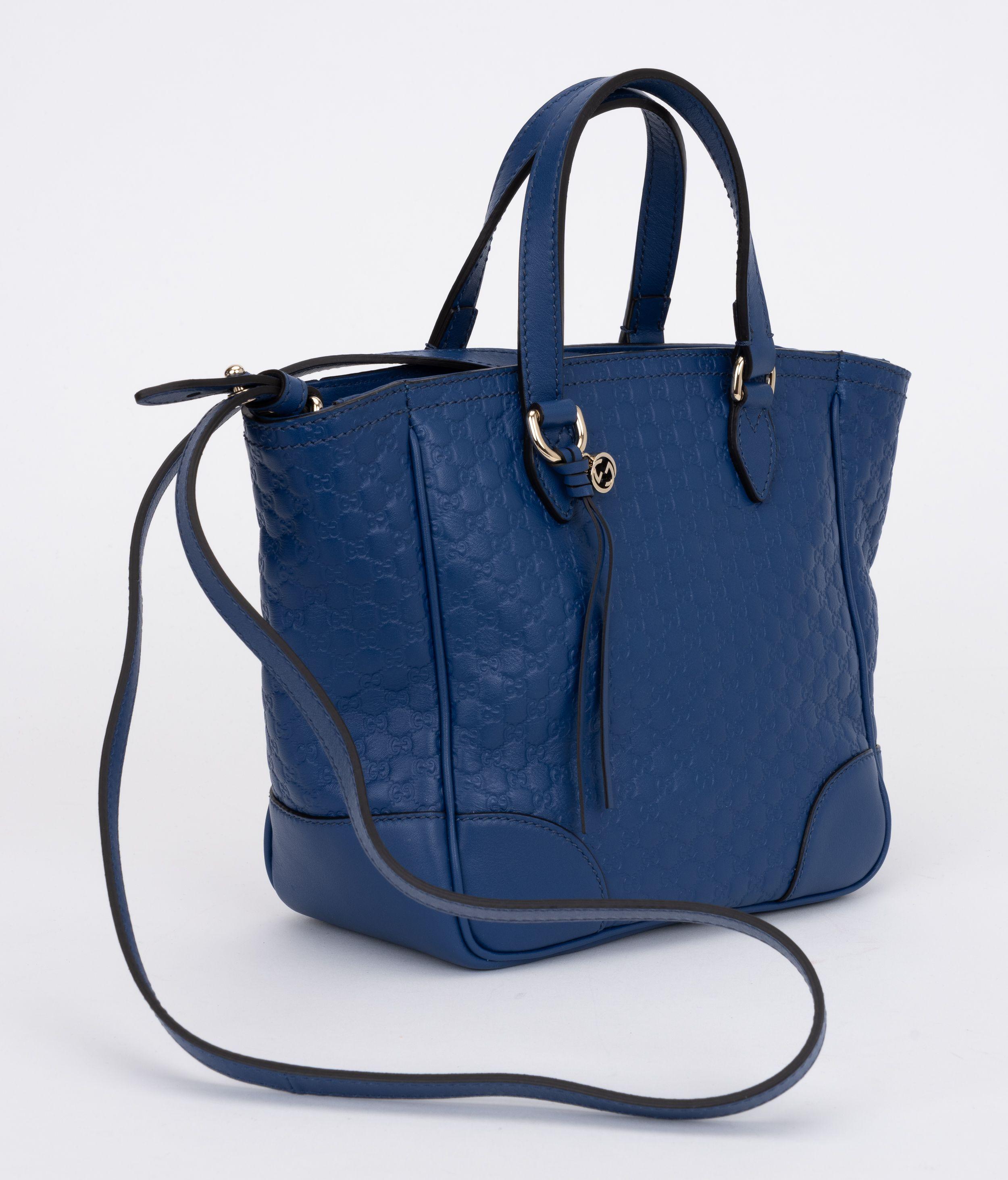 Gucci brand new blue leather handbag with multi logo embossed print. Handle drop 4
