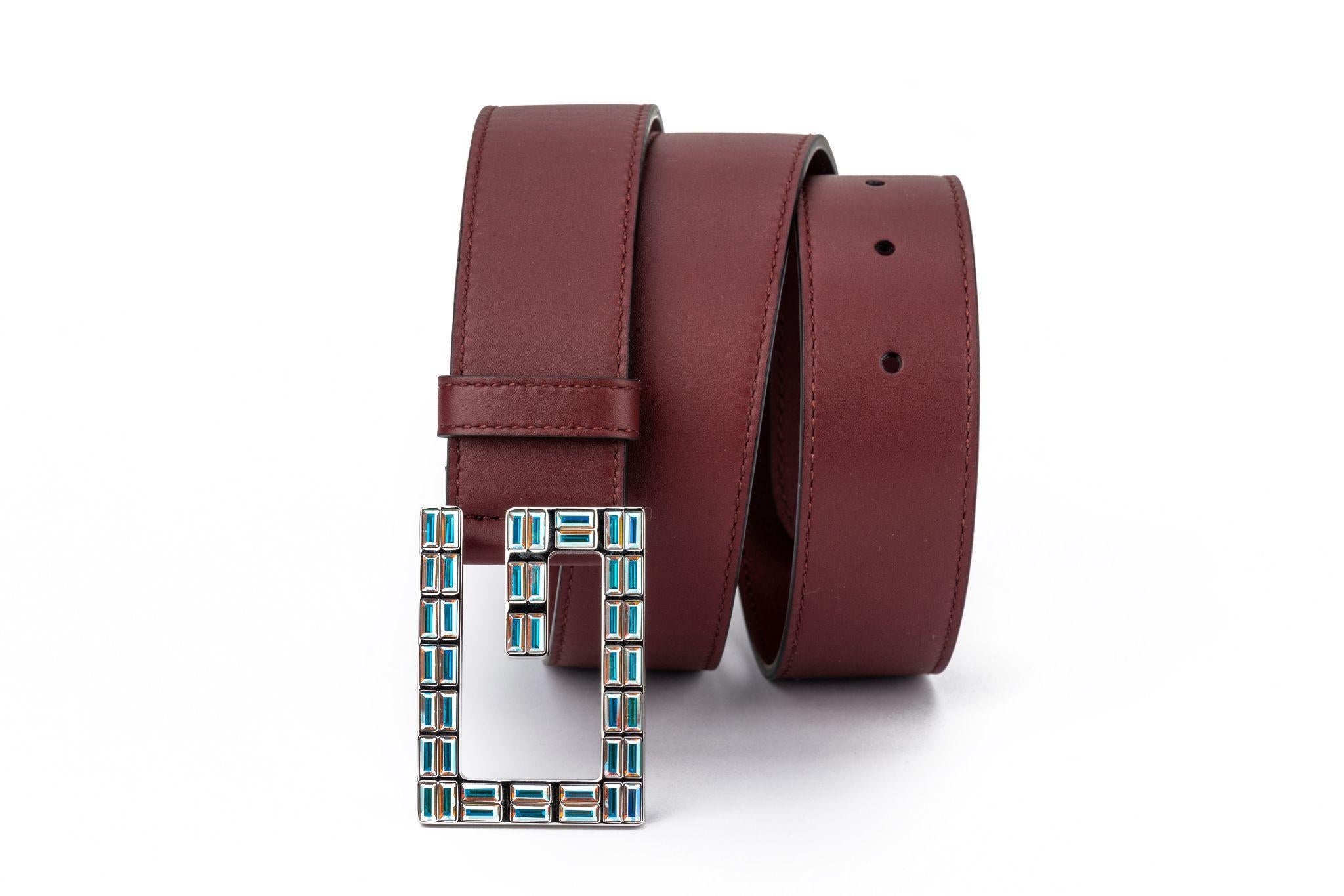 Gucci brand new burgundy leather belt with iridescent crystal buckle. 
Comes with original dust cover.