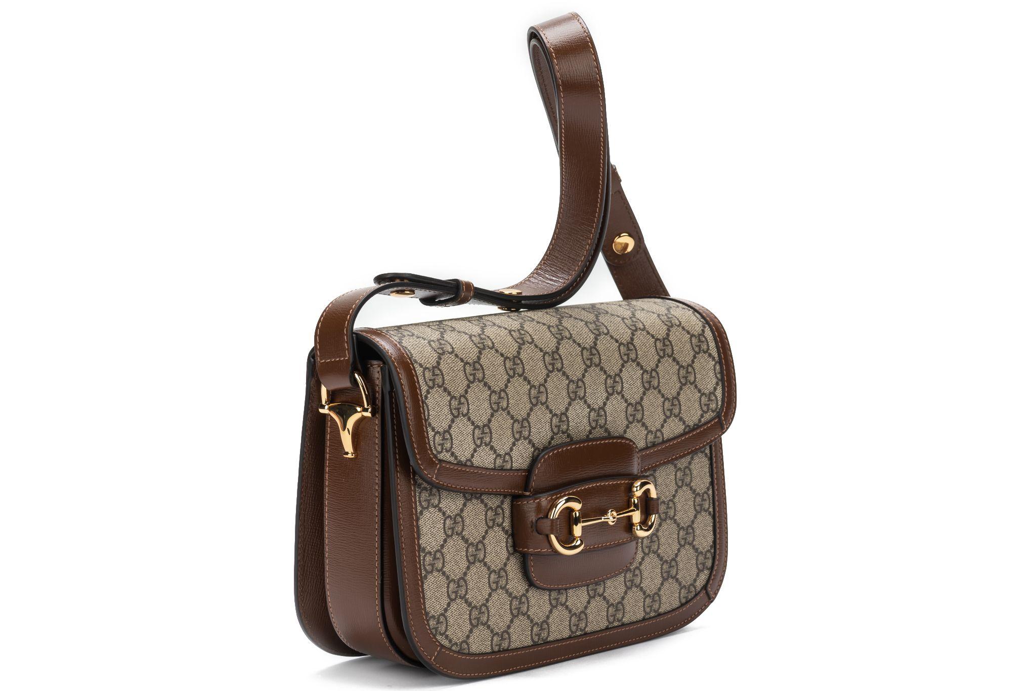 GUCCI Horsebit 1955 Shoulder Bag. The bag is new and comes with an adjustable shoulder strap which measures 9 inches. The item comes also with the booklet and original dustcover. Store price $2890.