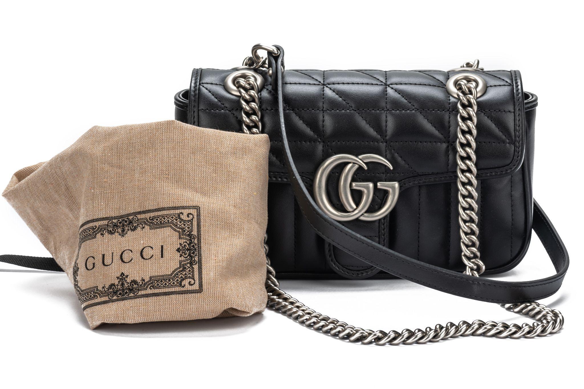 New Gucci Marmont Small Shoulder Bag in black. The straps measure 11' and are made of leather and metal. The interior is made of beige fabric. The bag comes with booklet and original dustcover. Store retail $2550.