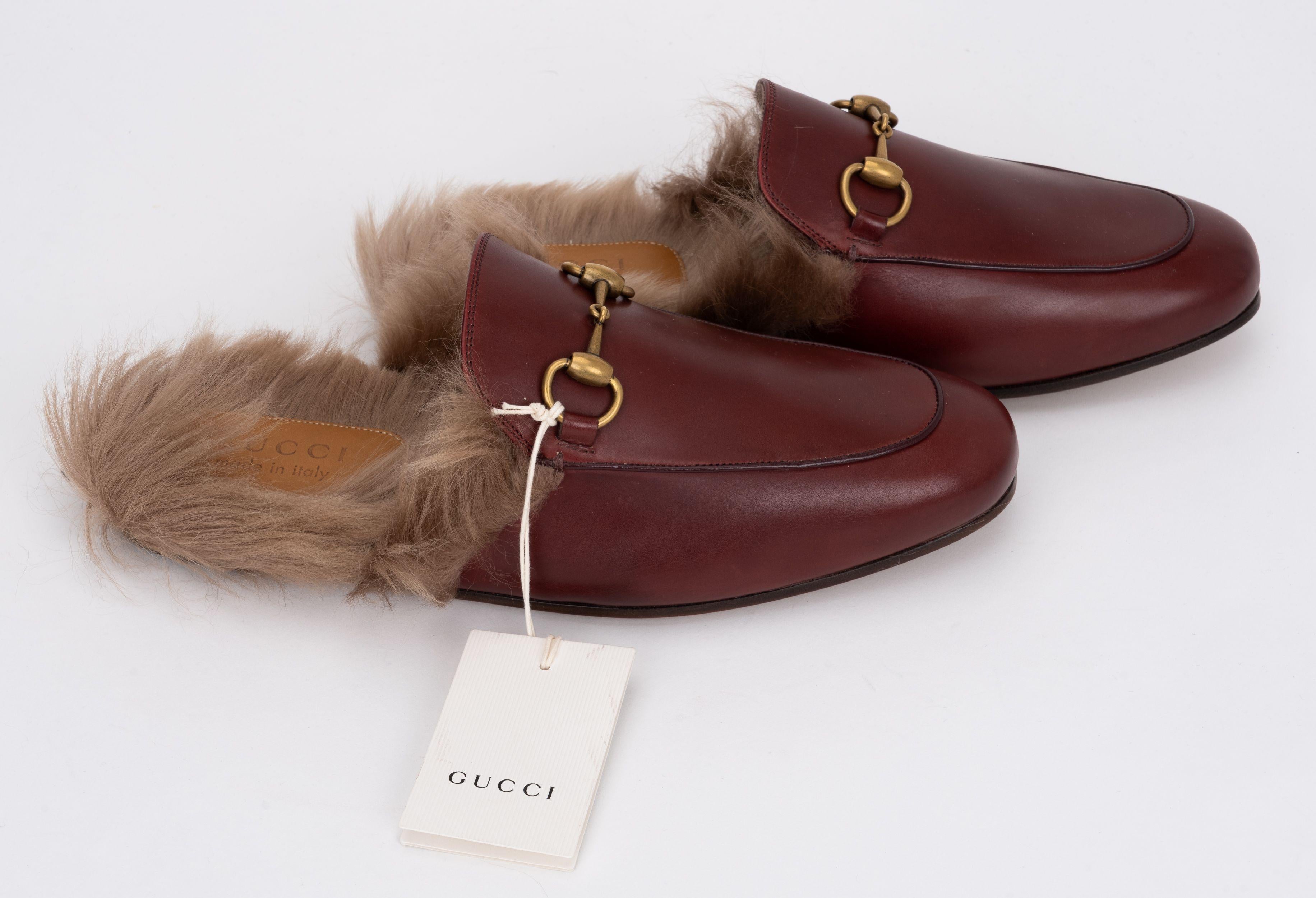 Gucci brand new maroon size 6 furry slippers. Men s size. 
The Princetown slipper is fully lined and trimmed with wool then finished with the House's signature Horsebit detail. Comes with box and double dust covers.