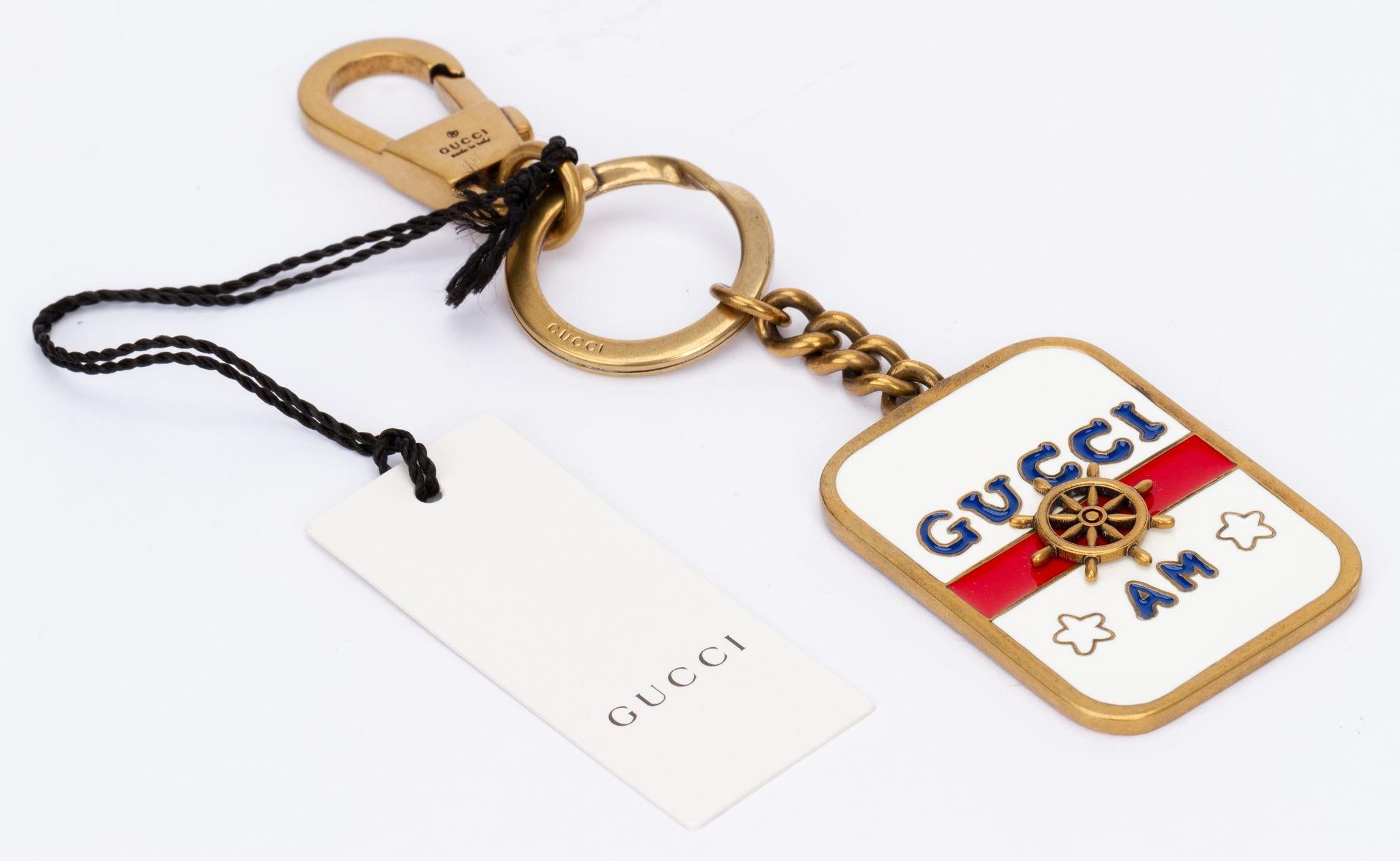 Gucci Multicolored nautical keychain. Featuring a marine-inspired design, a red, white and blue enamel detail, a rectangular silhouette, a key ring, a lobster clasp, an engraved logo on the back. The piece is brand new and comes with the tag,