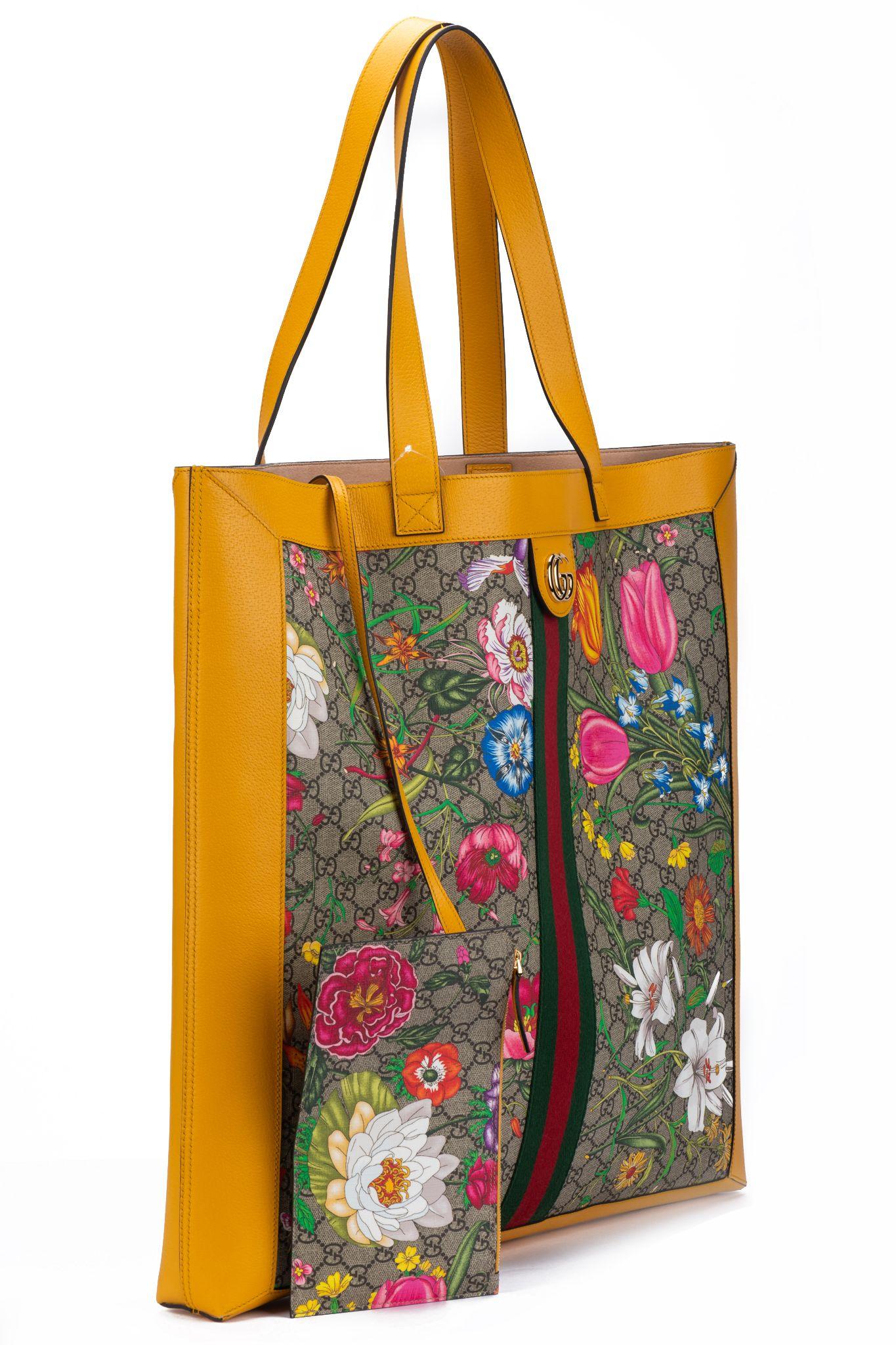 Gucci new rare and oversize flora shoulder tote with yellow soleil leather trim, shoulder drop 11”. Detachable interior matching pochette can be worn separately . Comes with booklet and original tag.