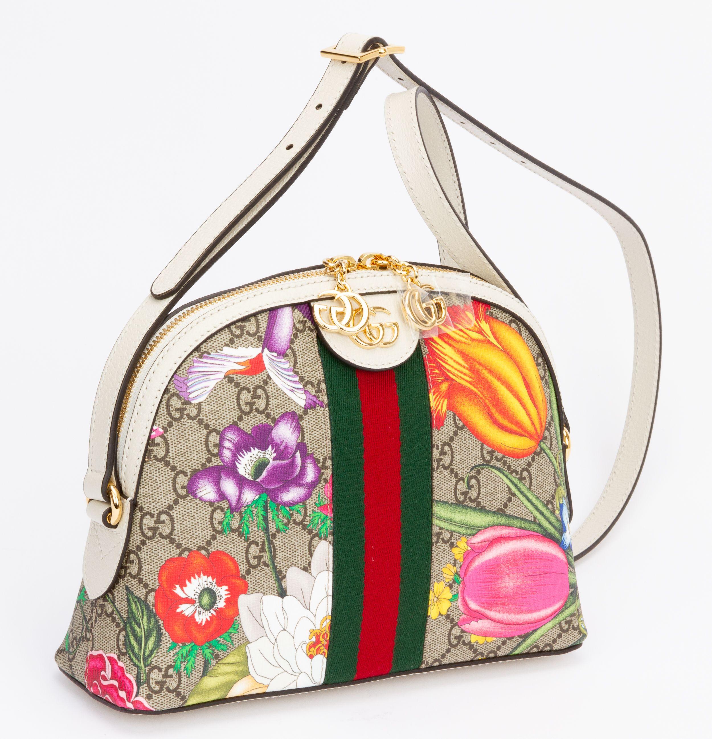 Gucci brand new flora print cross body bag with gold tone hardware and white leather. Shoulder drop 16