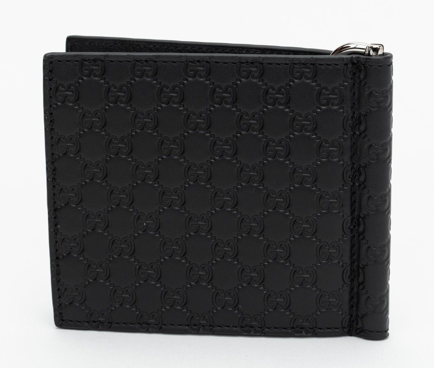 Gucci brand new wallet in black guccissima print leather with center money clip. 6 credit card slots. Comes withe orignla box, booklet and dust cover.