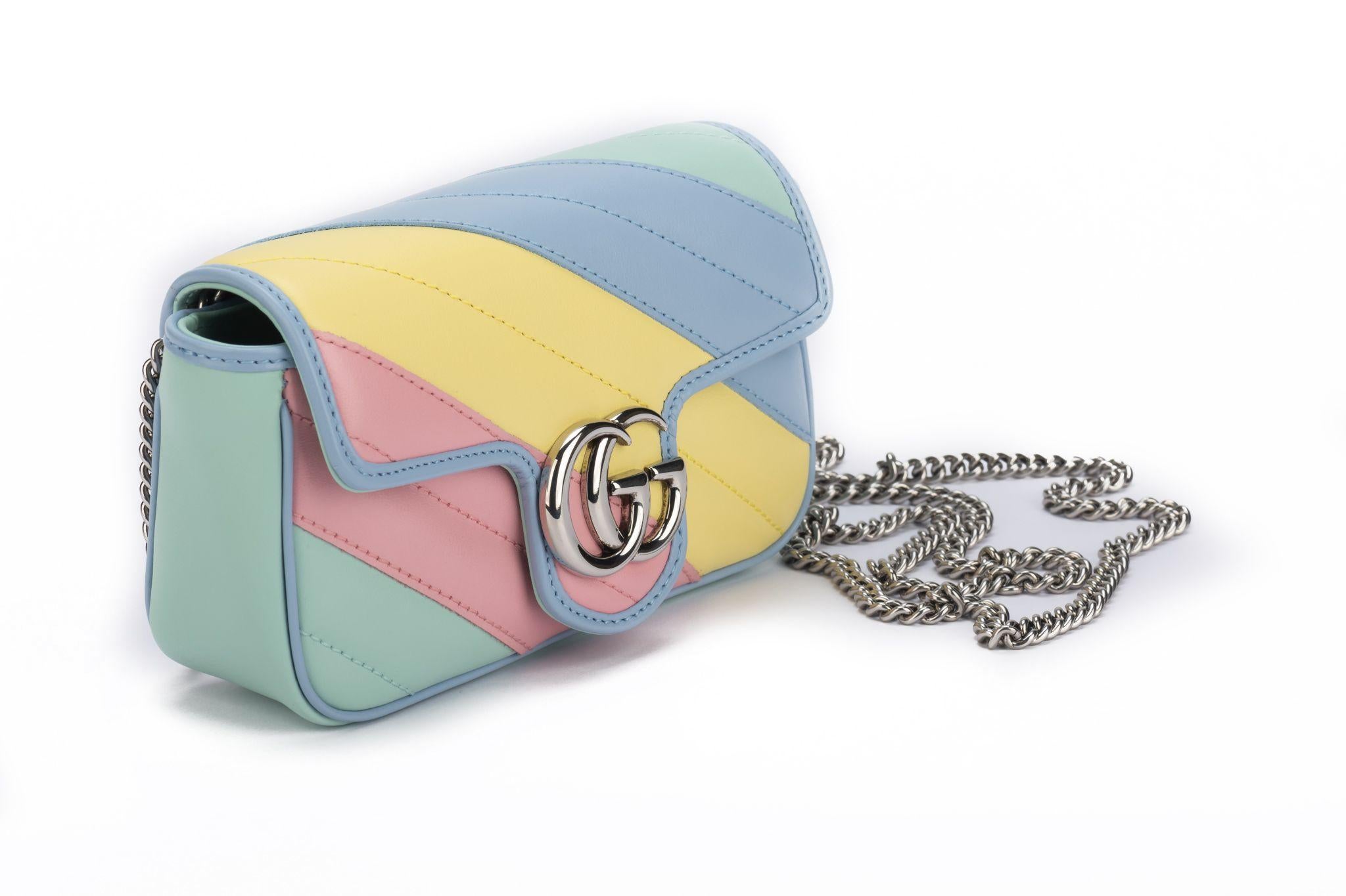Gucci new in box limited edition rainbow small Marmont Cross body bag . Pastel colors and diagonal quilting. Detachable silver shoulder chain, drop 23”. Comes with booklet, original dust cover and box.