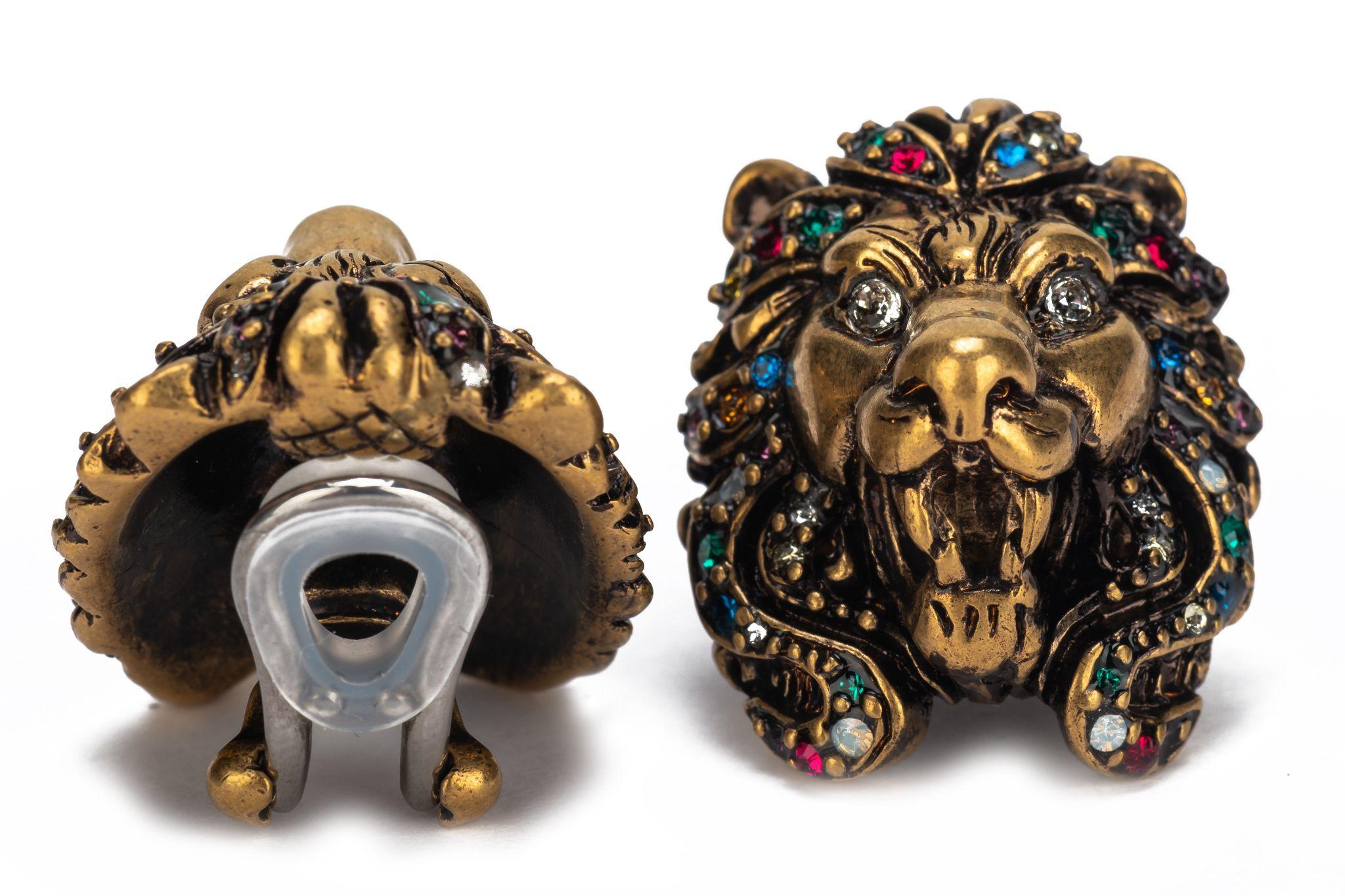Gucci new lionshead clip earrings in brass metal and multicolor rhinestones. Com with original box and dust cover.