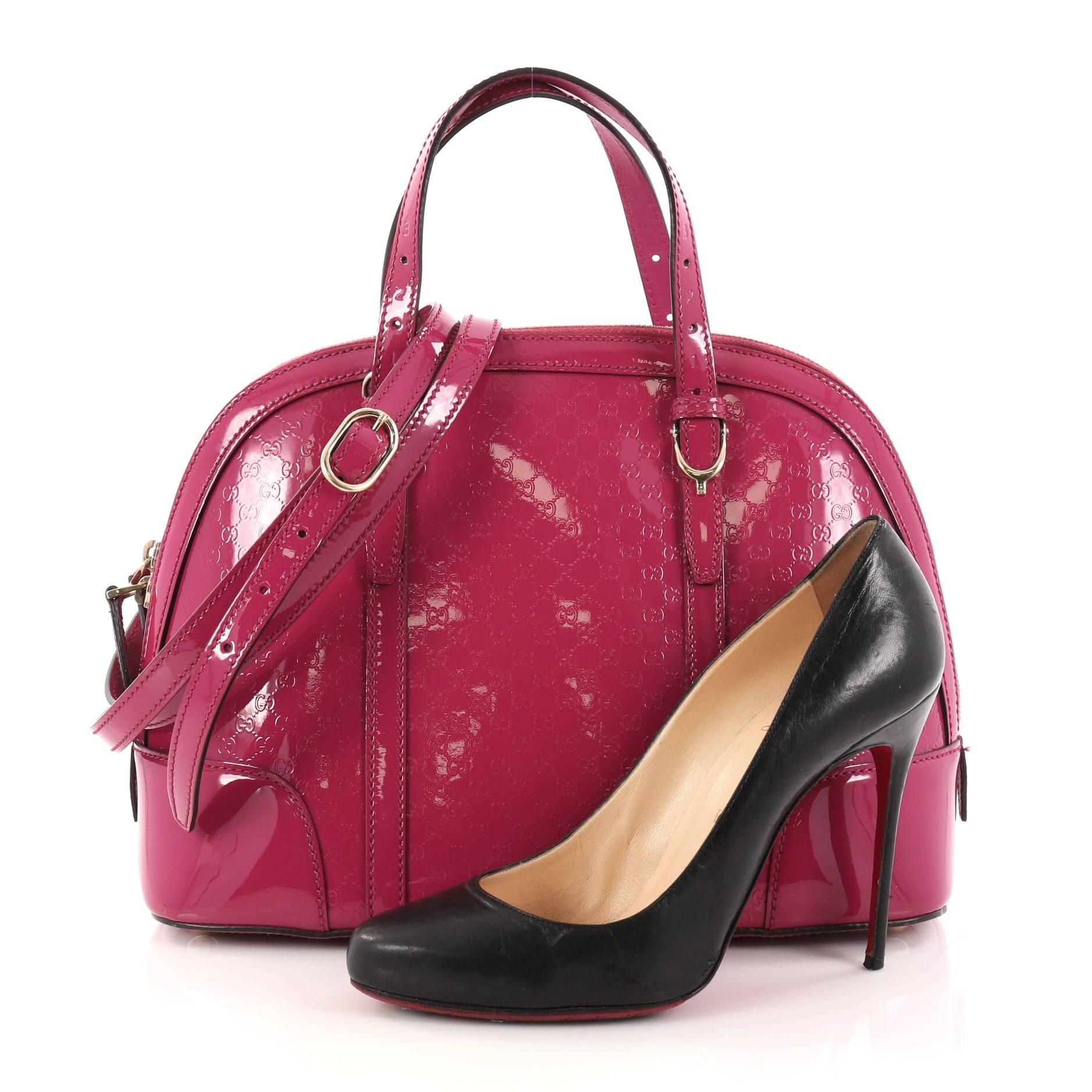 This authentic Gucci Nice Top Handle Bag Patent Microguccissima Leather Small is stylish in design perfect for modern fashionistas. Crafted in fuchsia patent microguccissima leather, this top handle bag from the brand's Nice Collection features
