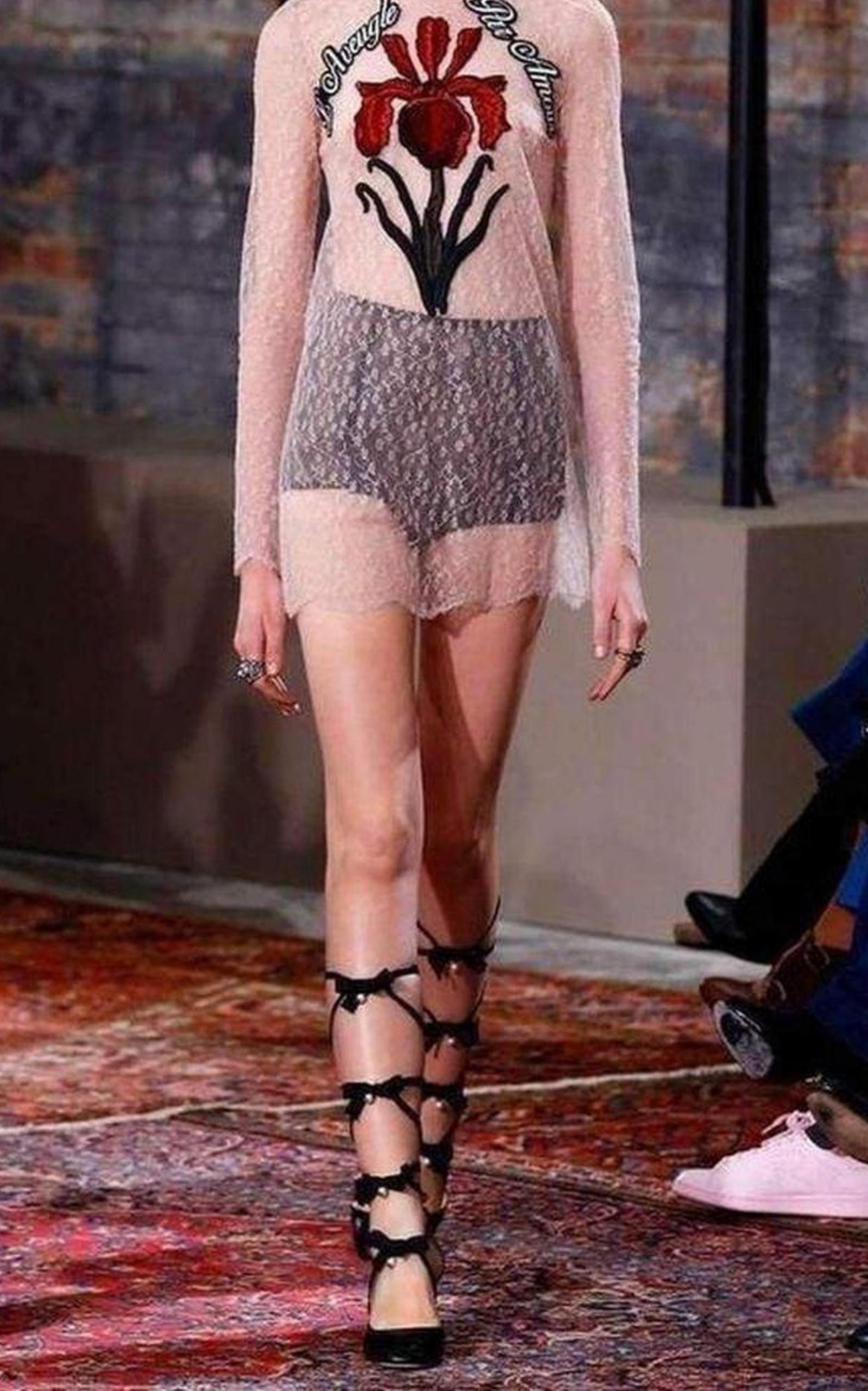 Lace with hand-applied embroidered patches on the front
Beige lace with embroidery
Light georgette piping at the neckline
Hand-applied embroidered patches
Straight fit
Nude silk lining
Back drop closure 
Made in Italy
