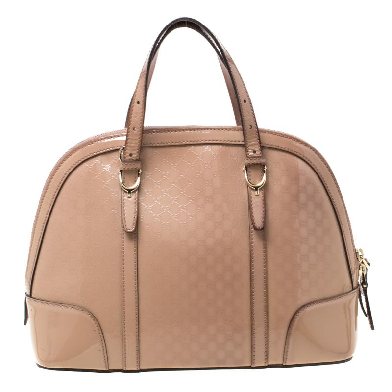 Modernize your choice of accessories by adding this Microguccissima patent leather satchel to your collection. Stow all your everyday essentials in the fabric-lined interior of this stunning piece. This eye-catching bag by Gucci is the exemplar of