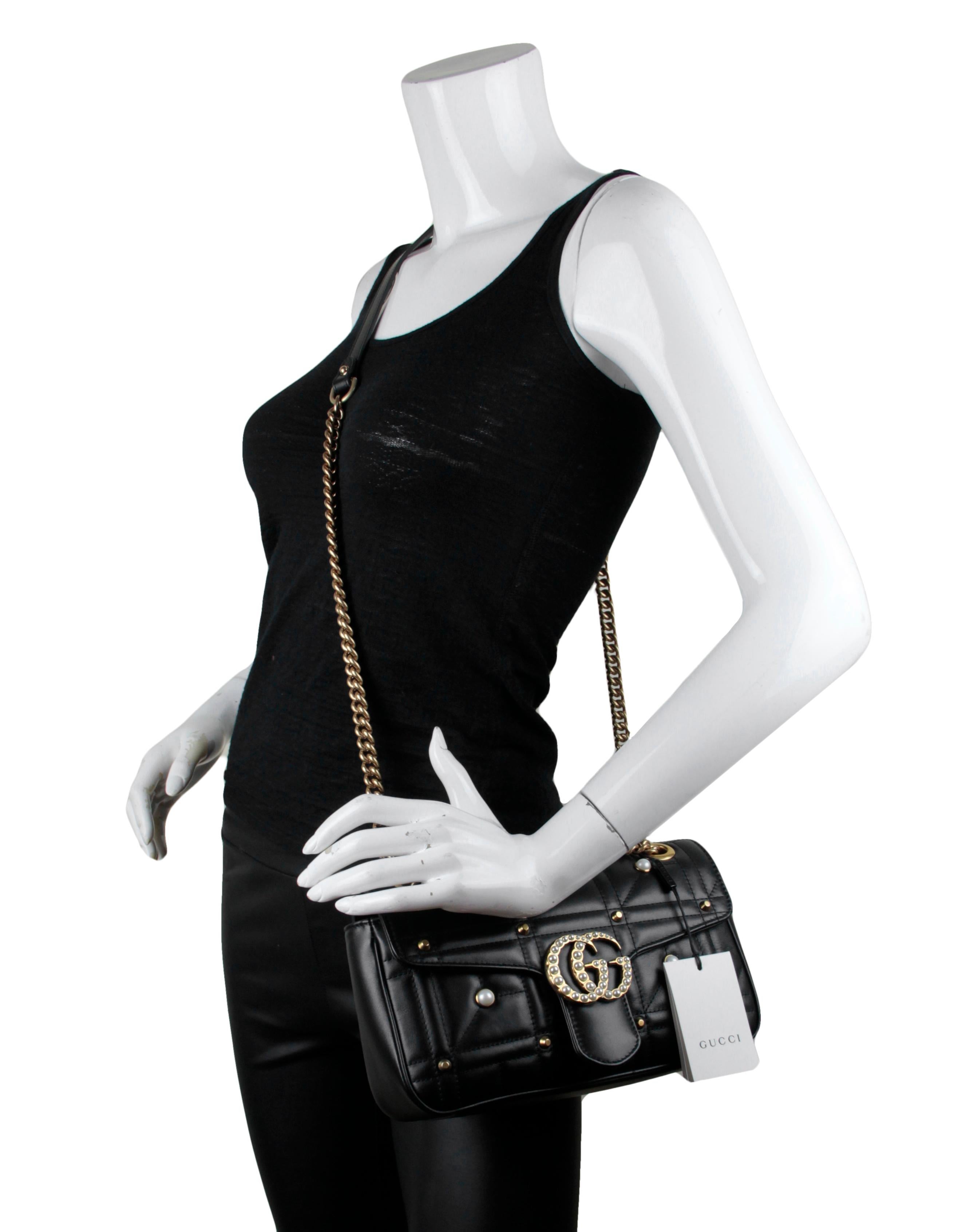 Gucci NWT Black Small GG Marmont Matelassé Pearl Studded Shoulder Bag. Features a sliding chain strap that can be worn as a crossbody bag with a 22” drop or as a shoulder bag with a 12” drop.

Made In: Italy
Year of Production: 2021
Color: Black